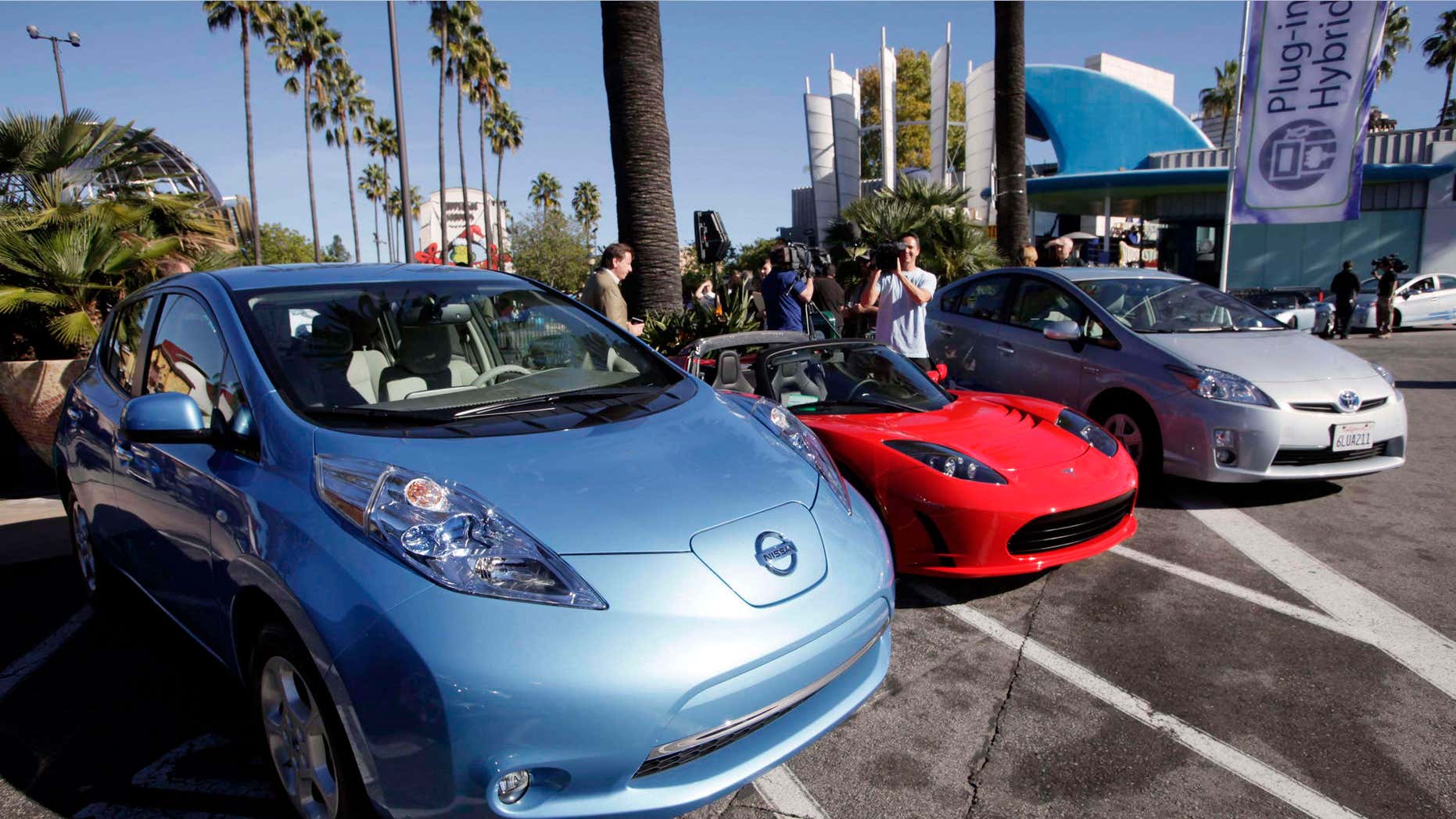 Dec. 13, 2013: File photo shows from left, electric cars from Nissan,Tesla, and Toyota presented at a news conference in Los Angeles.