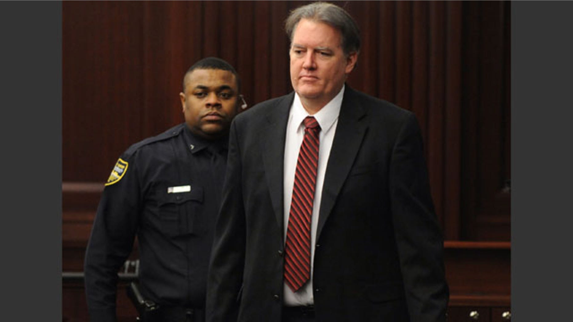 February 15, 2014: Defendant Michael Dunn is brought into the courtroom, where Judge Russell Healey announced that the jury was deadlocked on charge one and have verdicts on the other four charges as they deliberate in the trial of Dunn for the shooting death of Jordan Davis in November 2012. (AP Photo/The Florida Times-Union, Bob Mack, Pool)