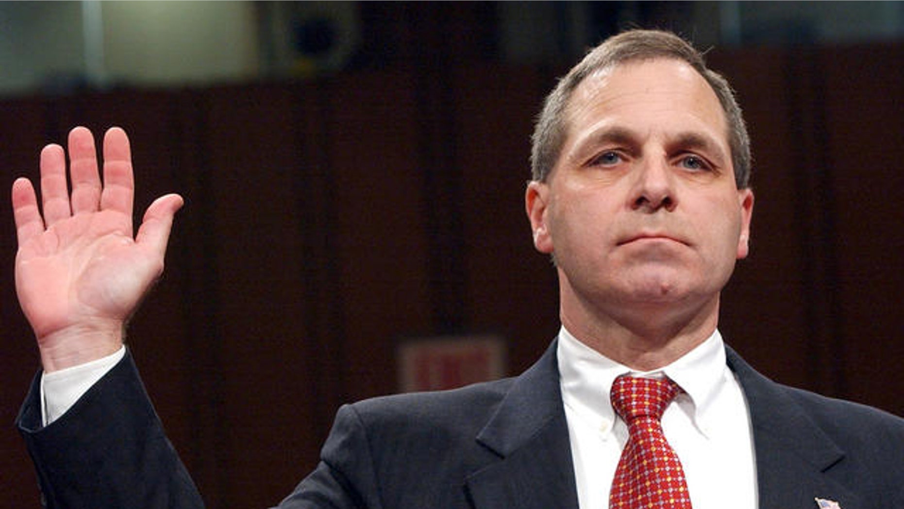 In this file photo, Louis Freeh, former FBI director, is sworn in at September 11th commission hearings on Capitol Hill in Washington DC.