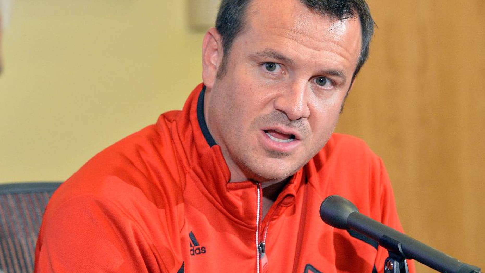 FILE - In this Oct. 20, 2014, file photo, Louisville women's head basketball coach Jeff Walz answers questions during their women's NCAA college basketball media day in Louisville, Ky. The departure of top scorer Shoni Schimmel leaves Louisville with a big offensive void to fill, but coach Jeff Walz isn't looking for any one player to fill it. (AP Photo/Timothy D. Easley, File)