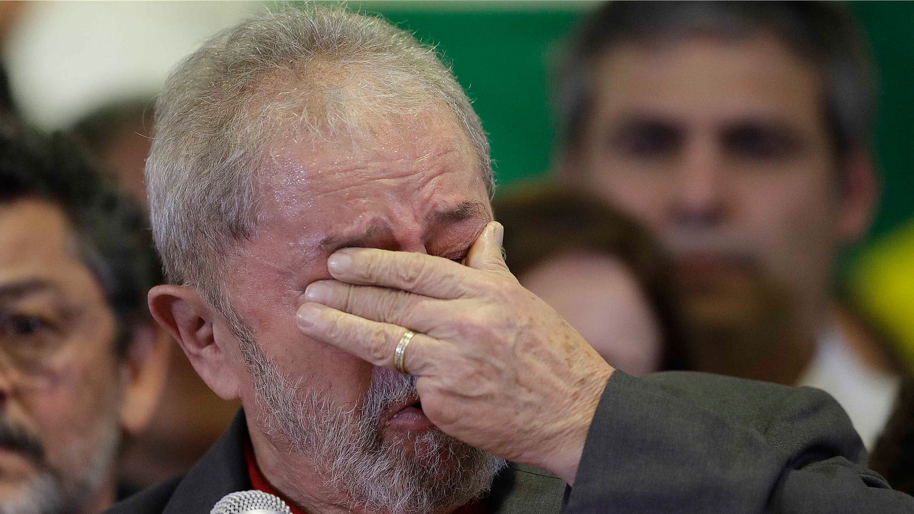 Lula da Silva weeps during a news conference on the corruption charges he is facing, on Thursday, Sept. 15, 2016.