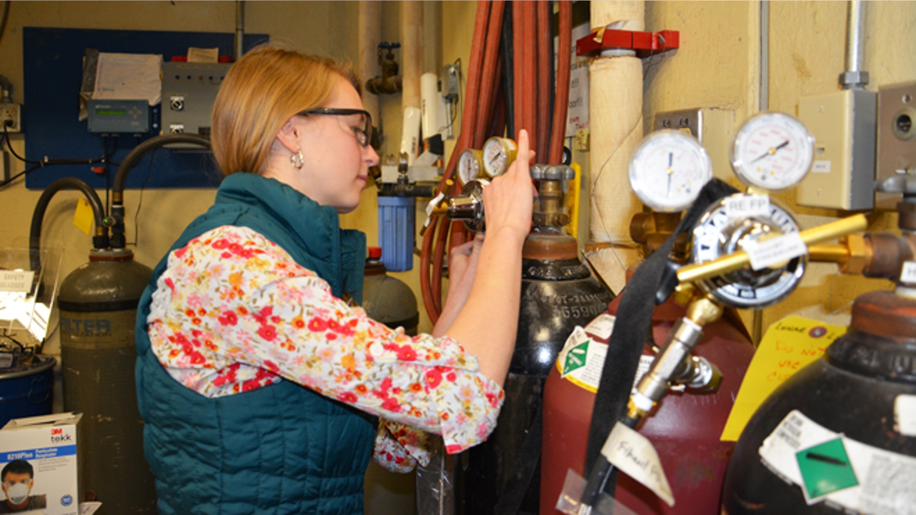 Gretchen Buttorf, an Aerospace Engineering junior at Penn St., tests a student-designed rocket engine test rig for the Lunar Lion moonlander.
