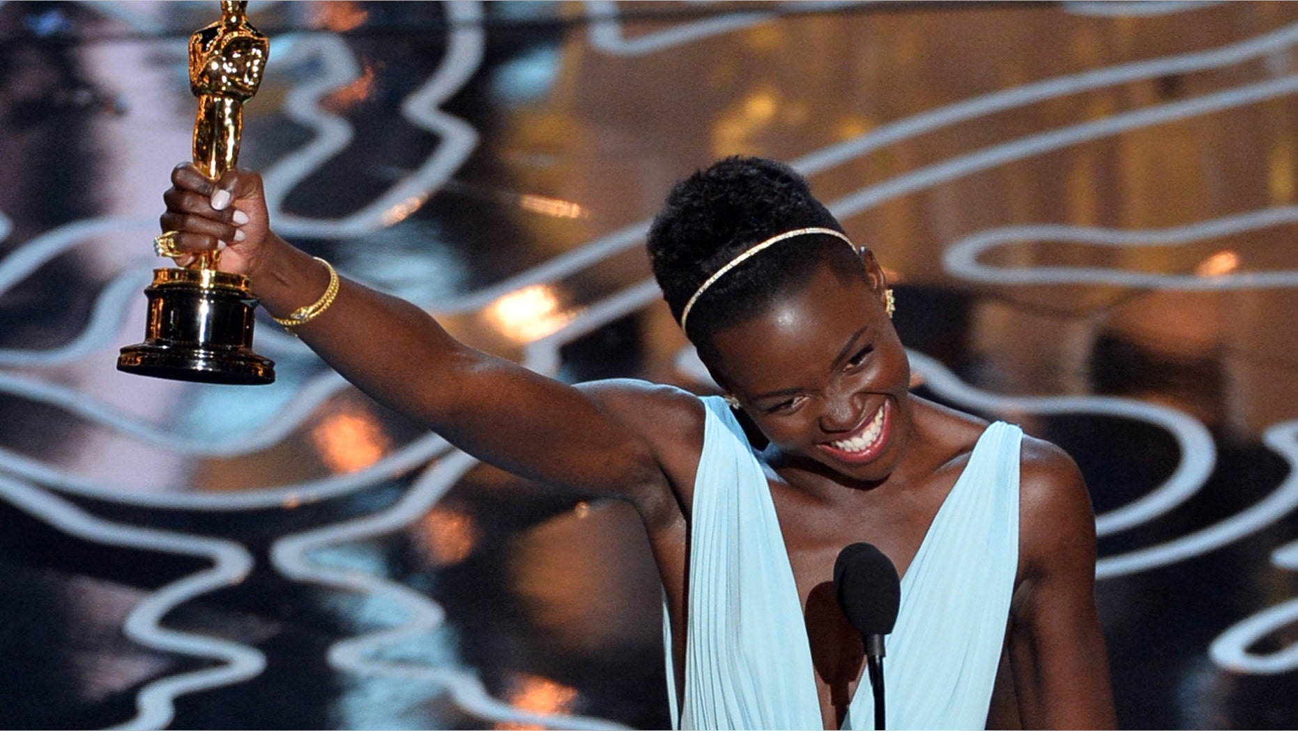 HOLLYWOOD, CA - MARCH 02: Actress Lupita Nyong'o accepts the Best Performance by an Actress in a Supporting Role award for '12 Years a Slave' onstage during the Oscars at the Dolby Theatre on March 2, 2014 in Hollywood, California. (Photo by Kevin Winter/Getty Images)