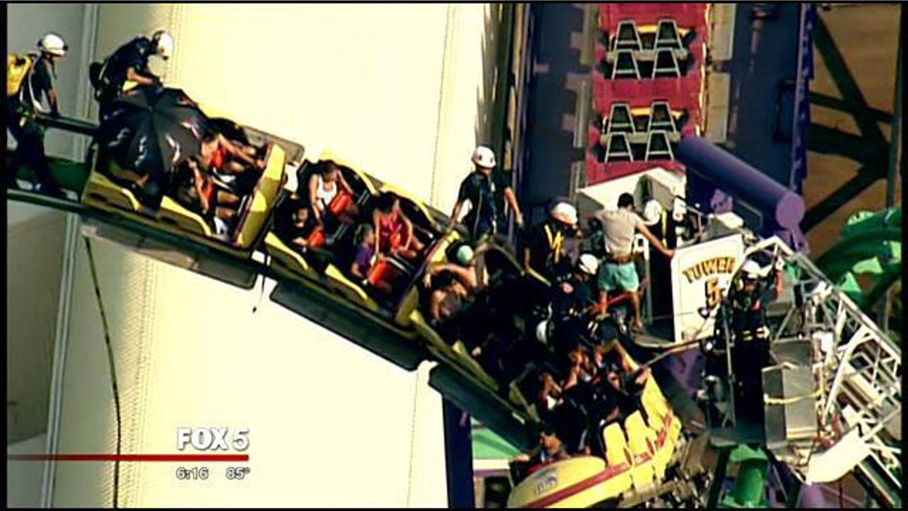 August 10, 2014: Rescuers work to remove patrons from a stuck roller coaster at Six Flags America in Upper Marlboro, Md. (MyFoxDC.com)