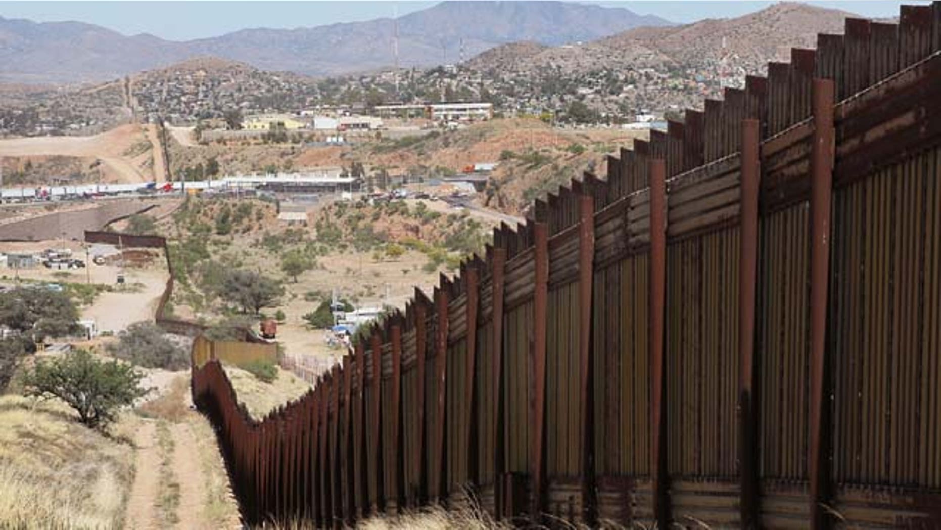 June 02, 2010: A fence separates the cities of Nogales, Arizona (L) and Nogales, Sonora Mexico, a frequent crossing point for people entering the United States illegally in Nogales, Arizona.