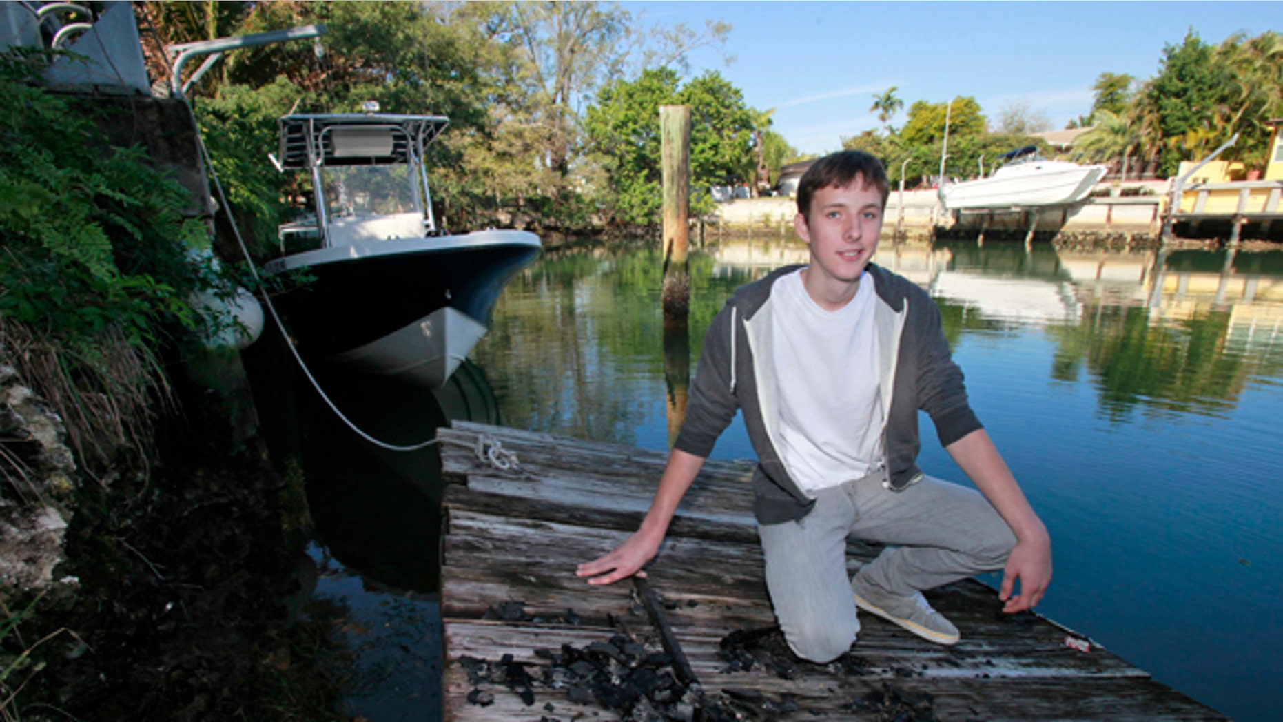 Jan 27, 2011: Nicholas Harrington, 16, poses on a dock in his back yard in Miami. Harrington, who said that he was looking to boost his art school application, took a bow for being the one behind the grand piano that mysteriously showed up on a sandbar in Miami's Biscayne Bay