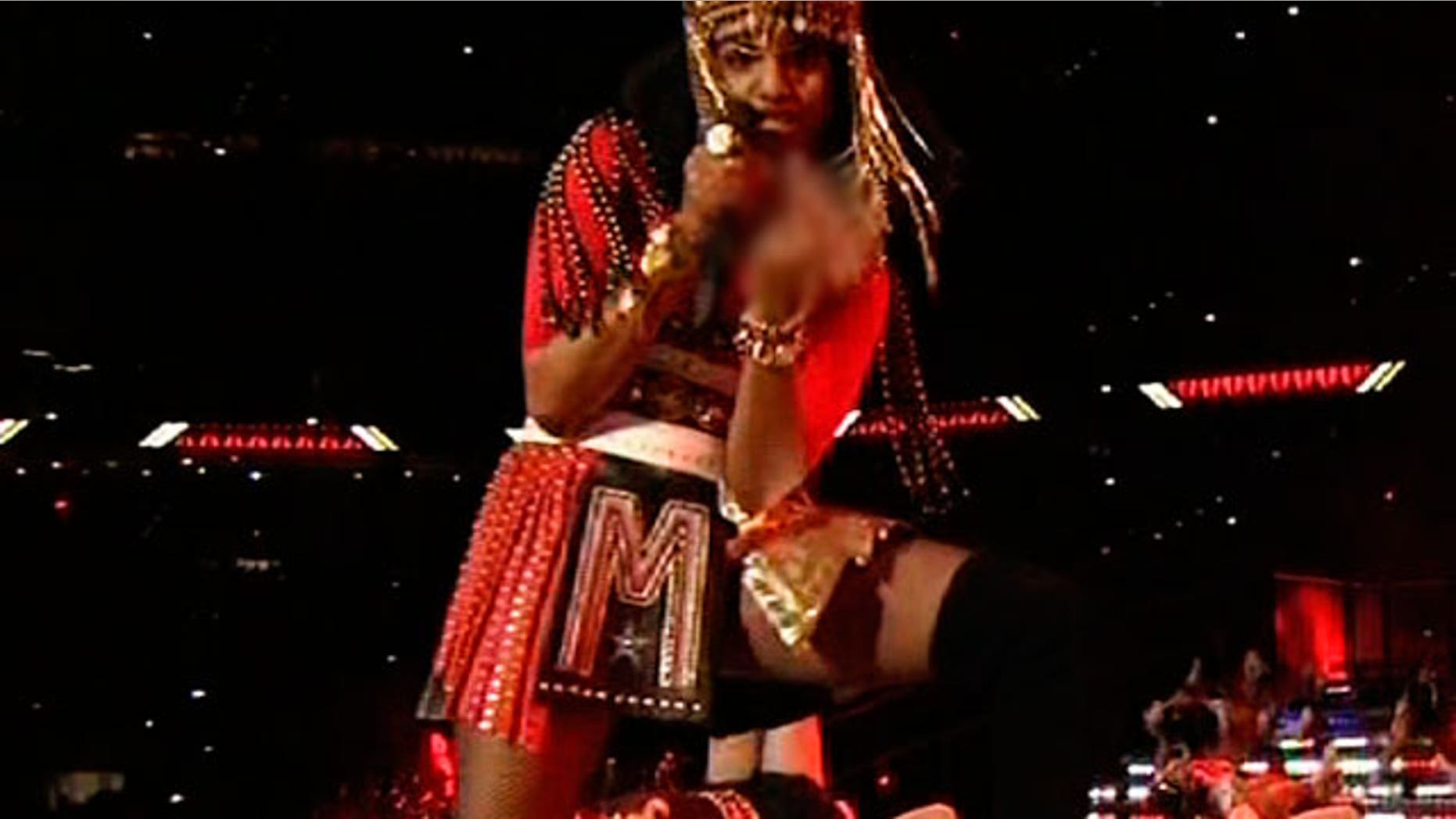 Feb 5: This image taken from video broadcast on NBC shows M.I.A. giving an obscene gesture during the Super Bowl XLVI halftime show in Indianapolis. (AP)