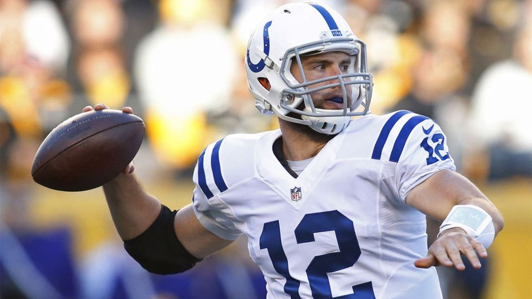 Oct 26, 2014; Pittsburgh, PA, USA; Indianapolis Colts quarterback Andrew Luck (12) passes against the Pittsburgh Steelers during the first quarter at Heinz Field. Mandatory Credit: Charles LeClaire-USA TODAY Sports