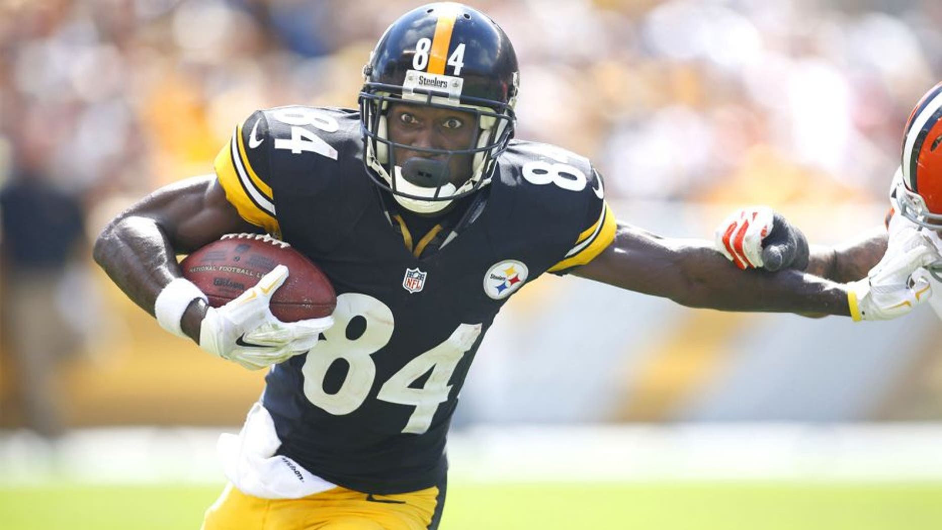 Sep 7, 2014; Pittsburgh, PA, USA; Pittsburgh Steelers wide receiver Antonio Brown (84) runs after a pass reception against the Cleveland Browns during the second quarter at Heinz Field. Mandatory Credit: Charles LeClaire-USA TODAY Sports