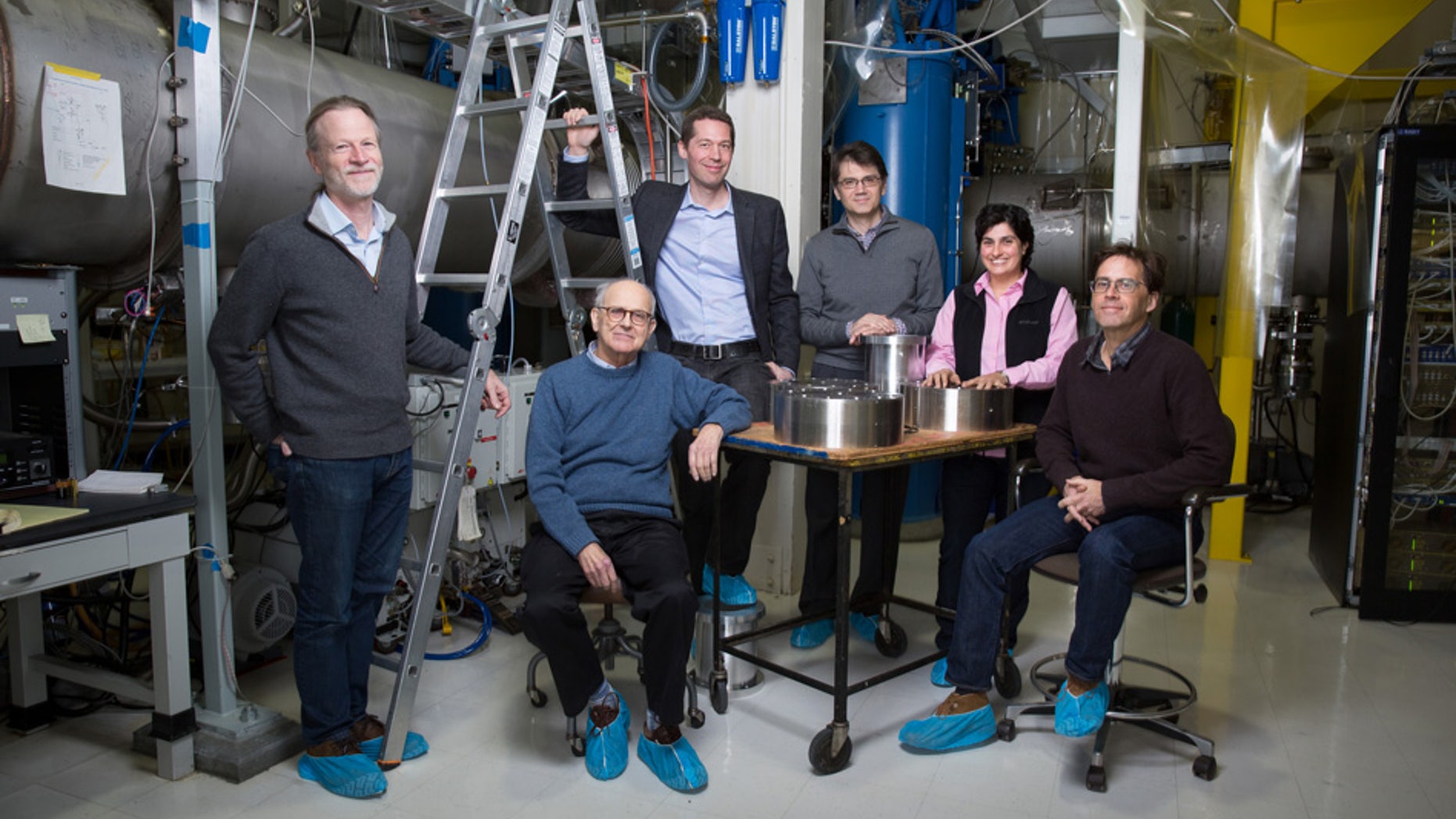 Rainer Weiss (center, seated) poses with members of the MIT LIGO team. Weiss was honored along with Caltech's Barry Barish and Kip Thorne with the 2017 Nobel Prize in physics for detecting gravitational waves.