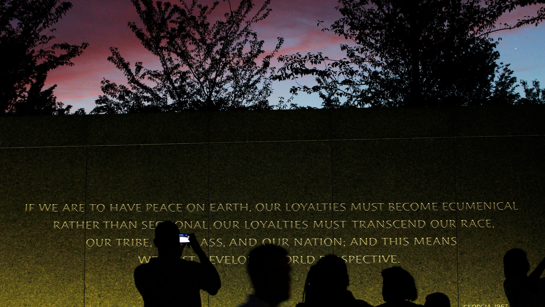 August 22: A quote is inscribed into the wall at the Martin Luther King, Jr. Memorial as it is seen at dusk ahead of its dedication this weekend in Washington.