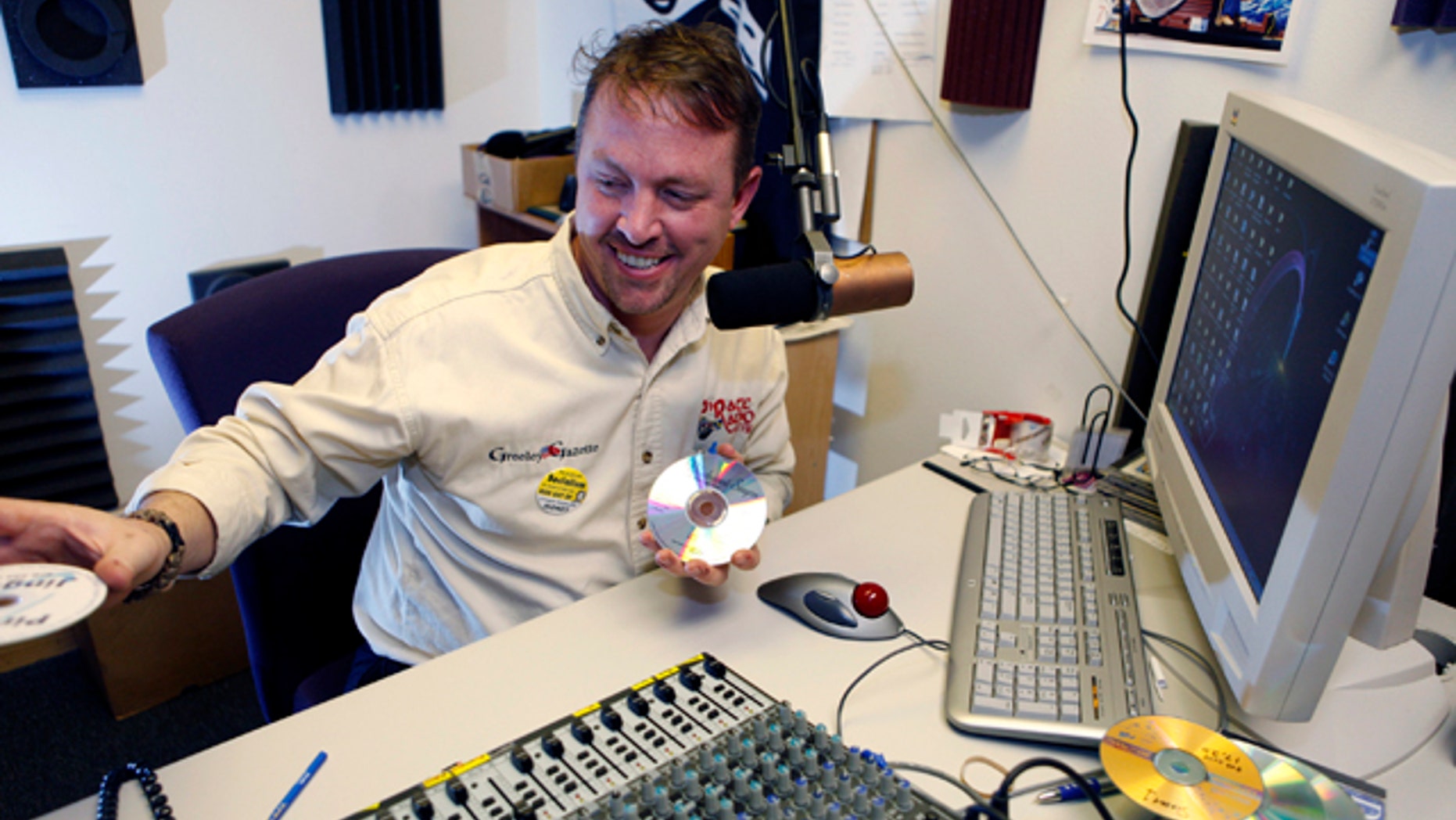 Jan. 14, 2011: Brett Reese is pictured at the controls in the studio of his radio station in Greeley, Colo.