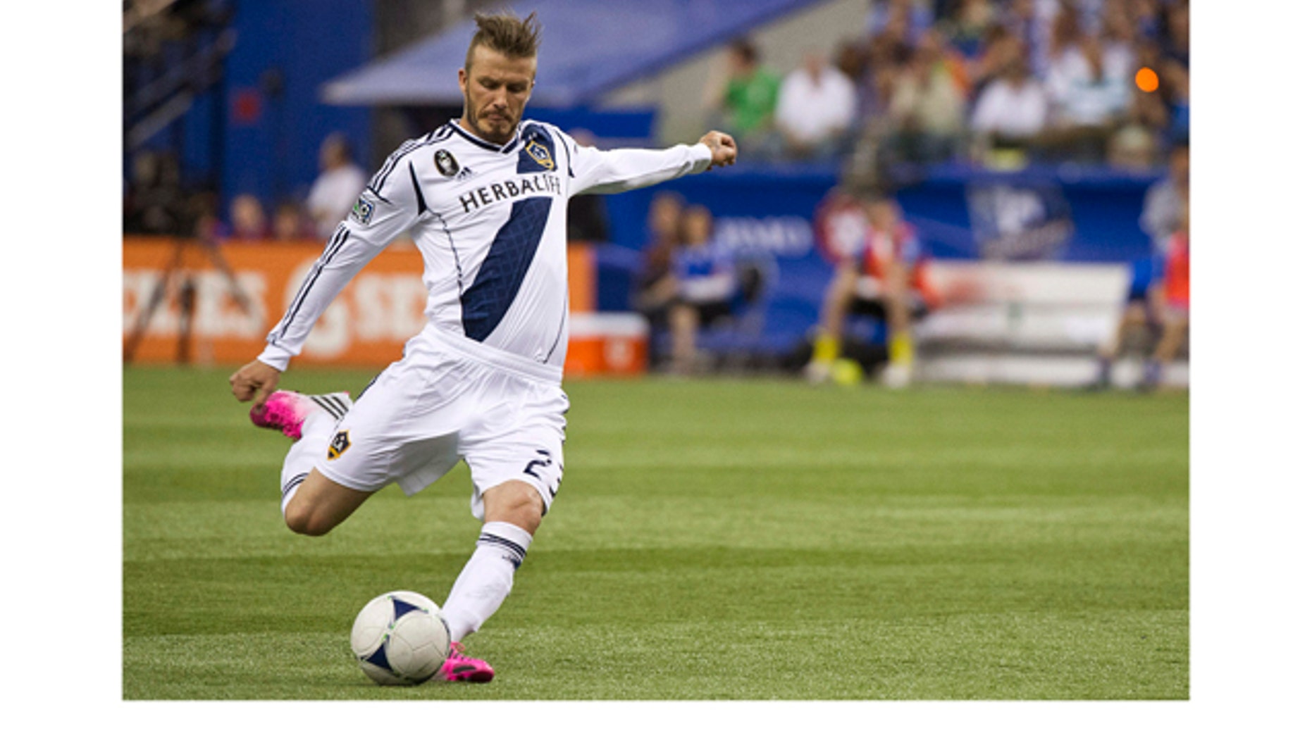 May 12, 2012: Los Angeles Galaxy's David Beckham scores a goal against the Montreal Impact during the second half of an MLS soccer match in Montreal.