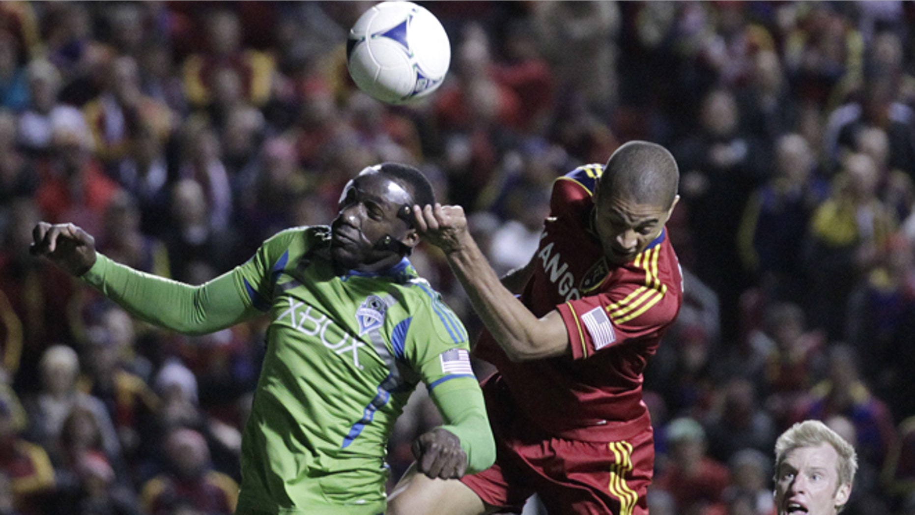 Seattle Sounders defender Jhon Kennedy Hurtado (34) heads the ball as Real Salt Lake forward Alvaro Saborio (15) defends in the second half during an MLS Western Conference semifinal soccer match Thursday, Nov. 8, 2012, in Sandy, Utah. The Sounders defeated Real Salt Lake. The match, the second of a two-match aggregate game, ended with a score of 1-0. (AP Photo/Rick Bowmer)