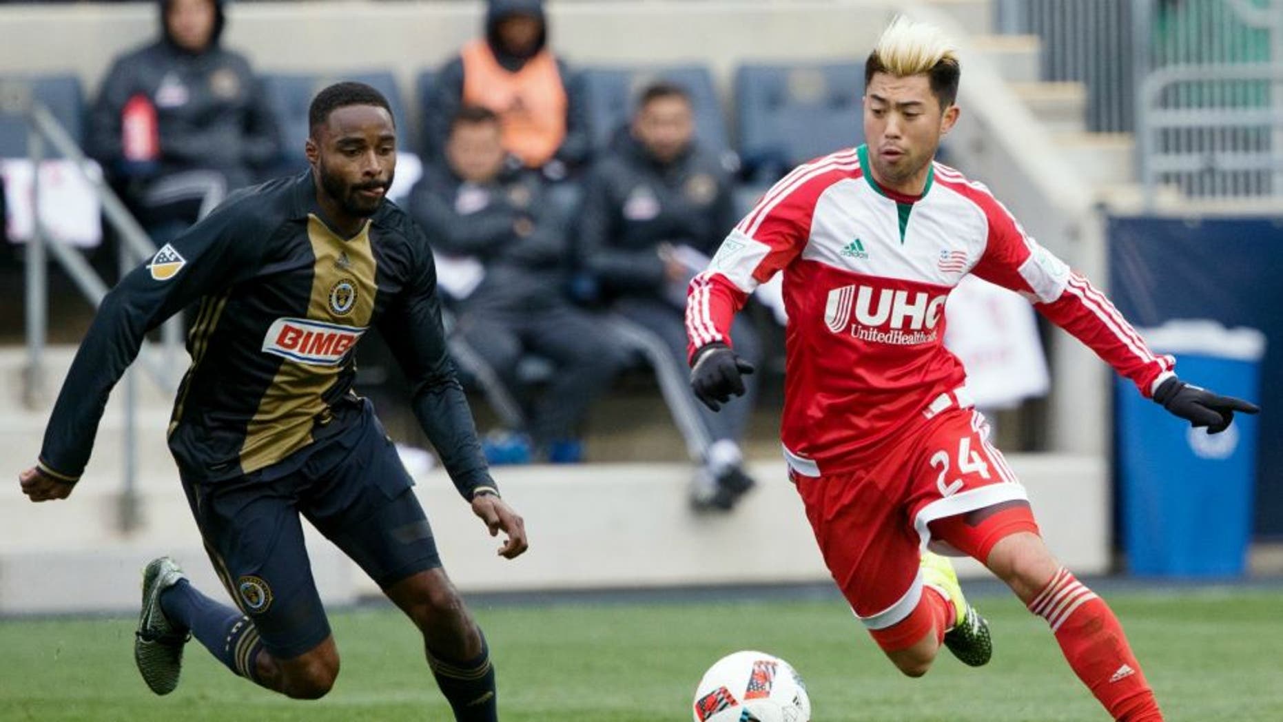 Mar 20, 2016; Philadelphia, PA, USA; New England Revolution defender Jose Goncalves (23) controls the ball past Philadelphia Union defender Warren Creavalle (2) during the first half at Talen Energy Stadium. Mandatory Credit: Bill Streicher-USA TODAY Sports