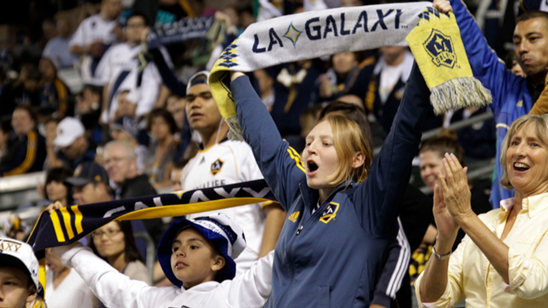 March 8, 2014: Los Angeles Galaxy fans cheer before a game against Real Salt Lake in an MLS soccer game in Carson, Calif. (AP/Reed Saxon)