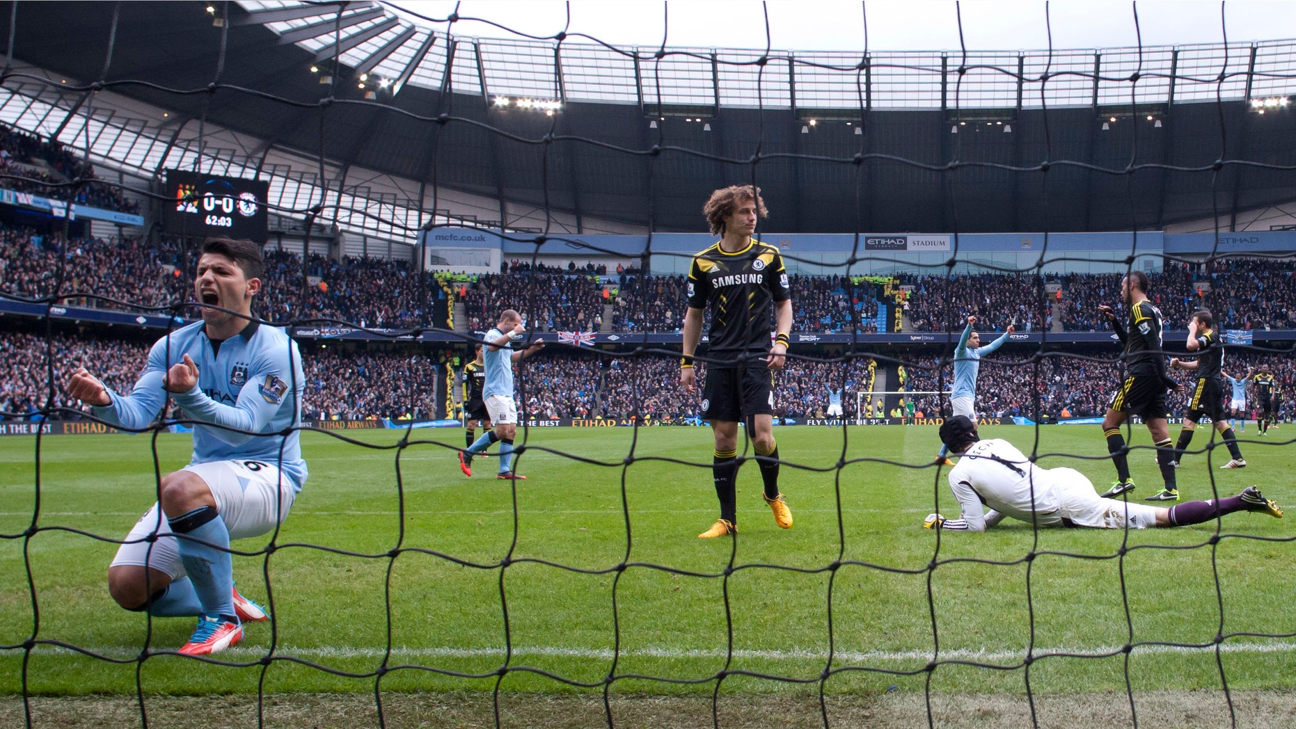 FILE - In this Feb. 24, 2013 file photo, Manchester City's Sergio Aguero, left, celebrates after a goal by teammate Yaya Toure, not shown, during their English Premier League soccer match against Chelsea at The Etihad Stadium in Manchester, England. The New York Yankees are partnering with Manchester City to own Major League Soccer's 20th team, which will be called New York City Football Club and plans to start play in the 2015 season. (AP Photo/Jon Super, File)