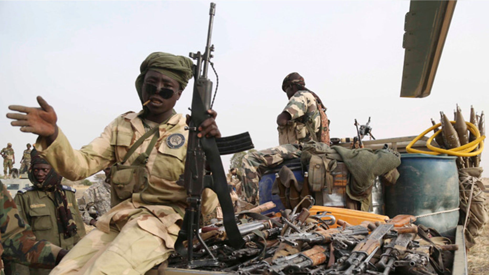 March 18, 2015:Chadian soldiers carry weapons captured from Boko Haram in a pickup truck in the recently retaken town of Damasak, Nigeria. (REUTERS/Emmanuel Braun)