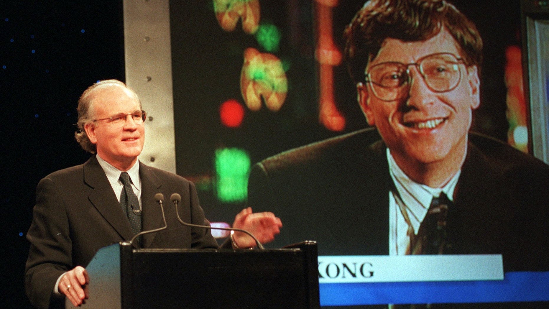 FILE: Robert Wright, president and chief executive officer of NBC, speaks in New York with Microsoft Chairman Bill Gates, displayed on screen, speaks from Hong Kong, during a news conference announcing that NBC and Microsoft would form a joint venture to start a cable news channel and related online service called MSNBC.