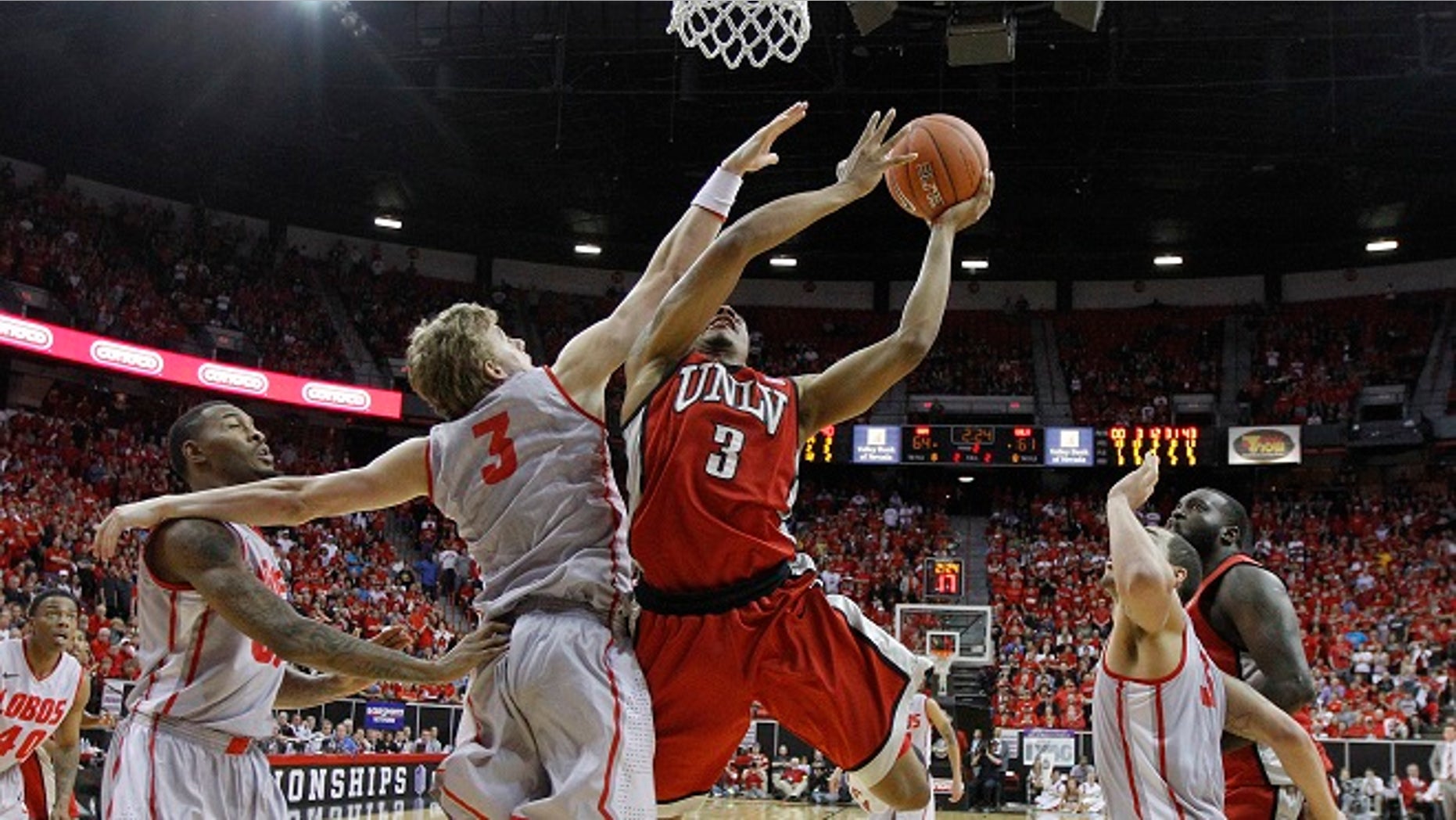 UNLV's Anthony Marshall is fouled by New Mexico's Hugh Greenwood in the second half of a semifinal NCAA college basketball game during the Mountain West Conference tournament, Friday, March 9, 2012, in Las Vegas. (AP Photo/Julie Jacobson)