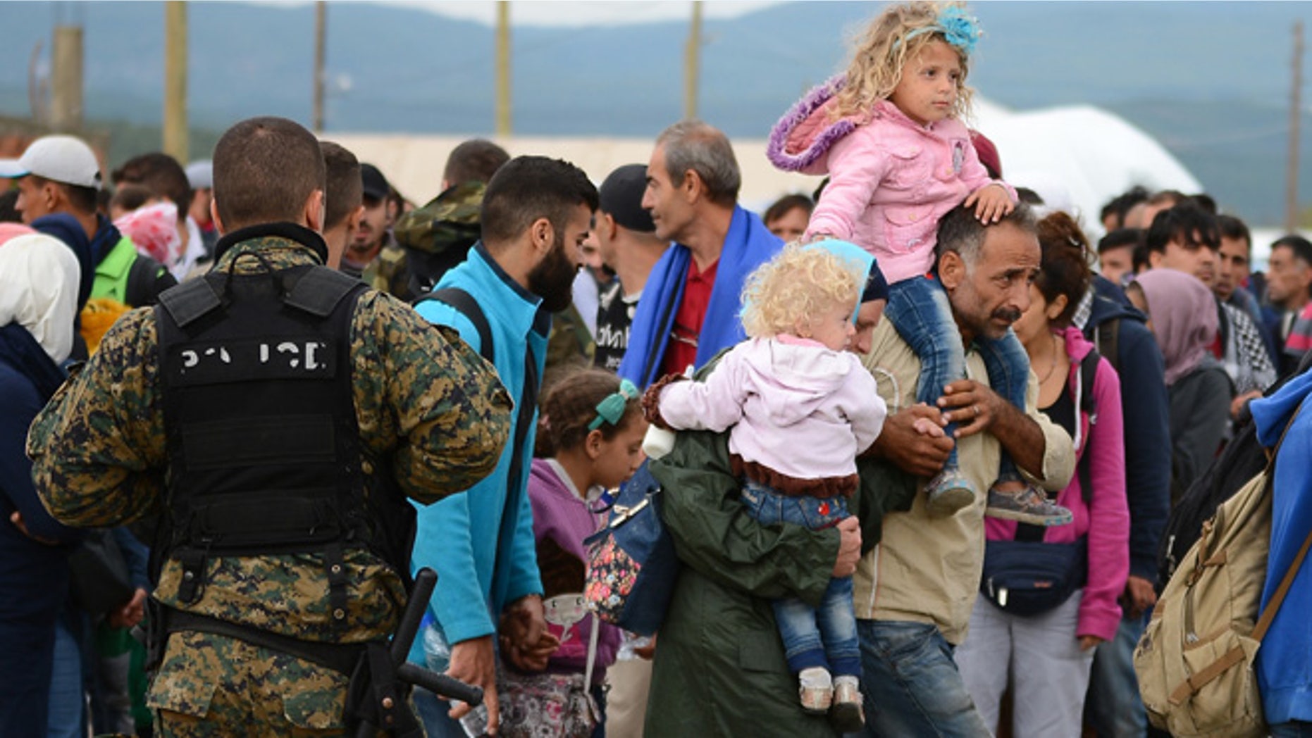 Sept. 8, 2015: People gather at a refugee camp in the southern Macedonian town of Gevgelija.