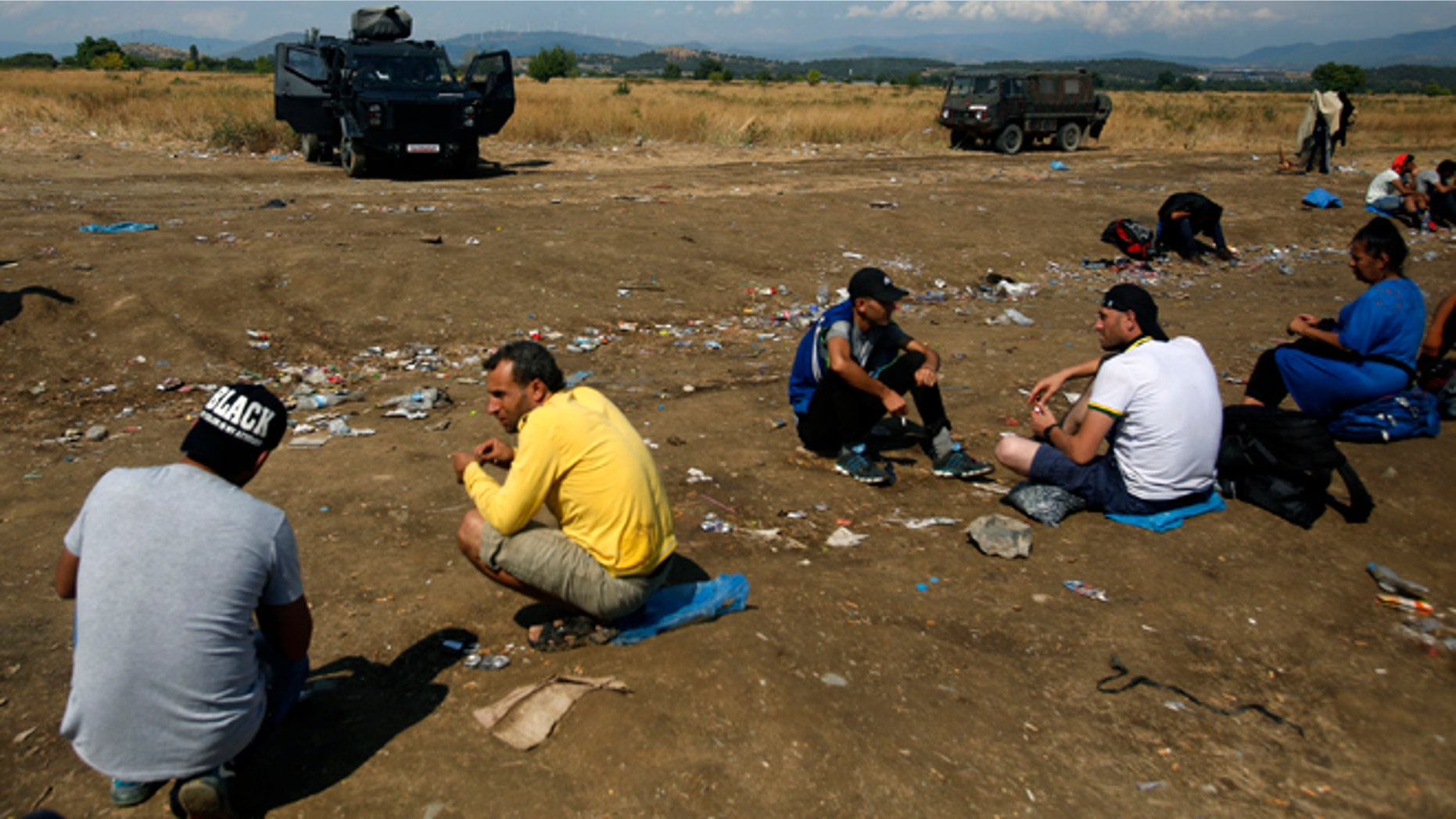 Aug. 20: Macedonian police block migrants at no-man's land between Greece and Macedonia near the southern Macedonian town of Gevgelija.