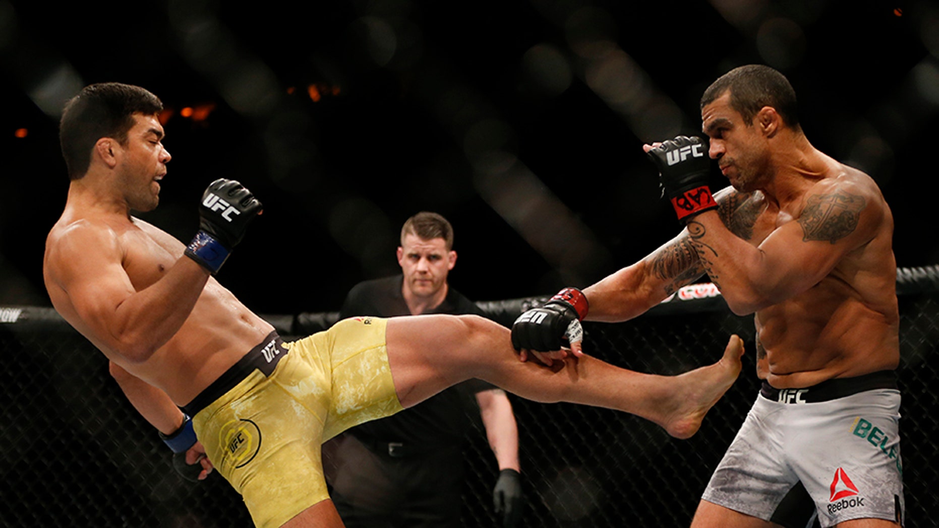 Vitor Belfort, from Brazil, right, and his countryman Lyoto Machida, fight during their UFC middleweight mixed martial arts bout in Rio de Janeiro, Brazil, Saturday, May 12, 2018