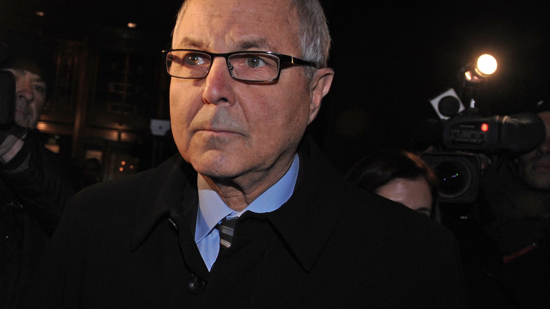 Dec. 20, 2012: Peter Madoff exits Manhattan federal court after receiving a 10 year sentence for his participation in the largest Ponzi scheme in history, in New York.