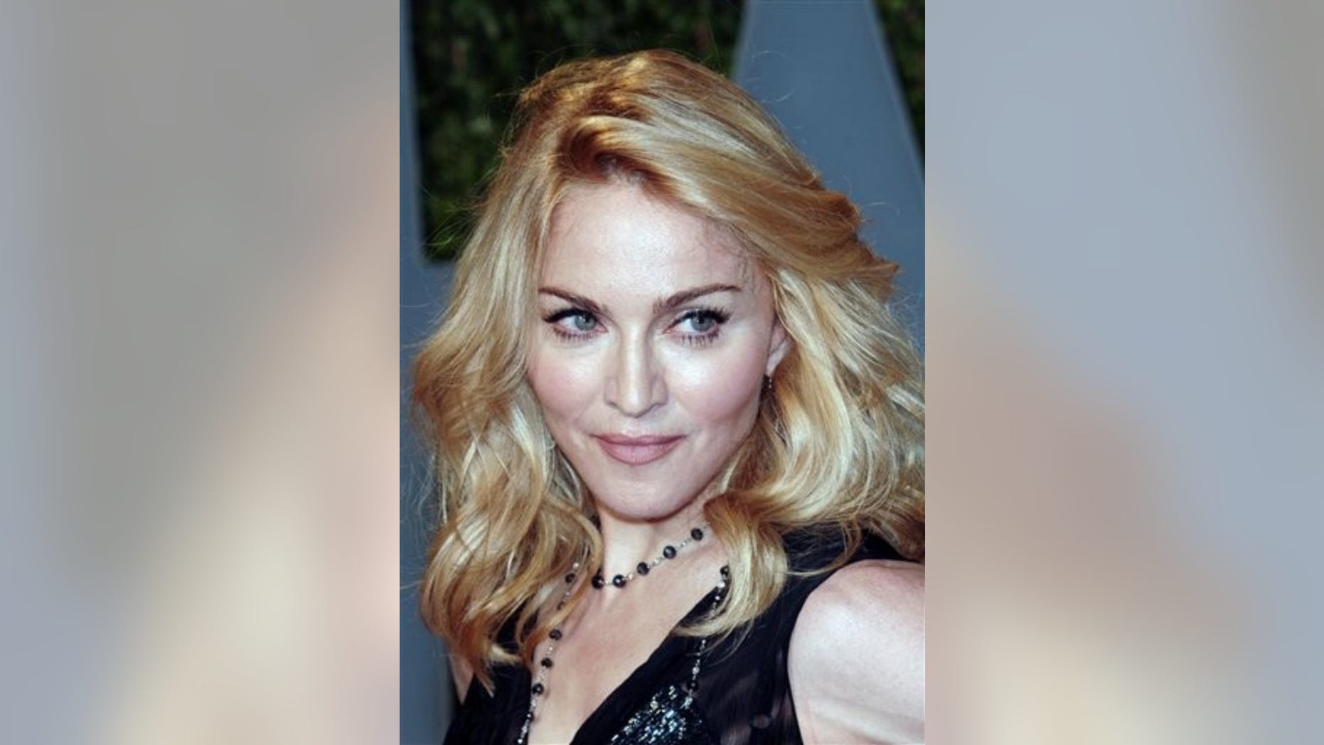 FILE - In this Feb. 22, 2009 file photo, Madonna arrives at the Vanity Fair Oscar party , in West Hollywood, Calif. The father of a girl from Malawi whom Madonna hopes to adopt says he's capable of taking care of his daughter. Madonna's appeal of a court ruling denying her request to adopt the girl is to be heard Monday, May 4, 2009, in Malawi. (AP Photo/Evan Agostini, file)