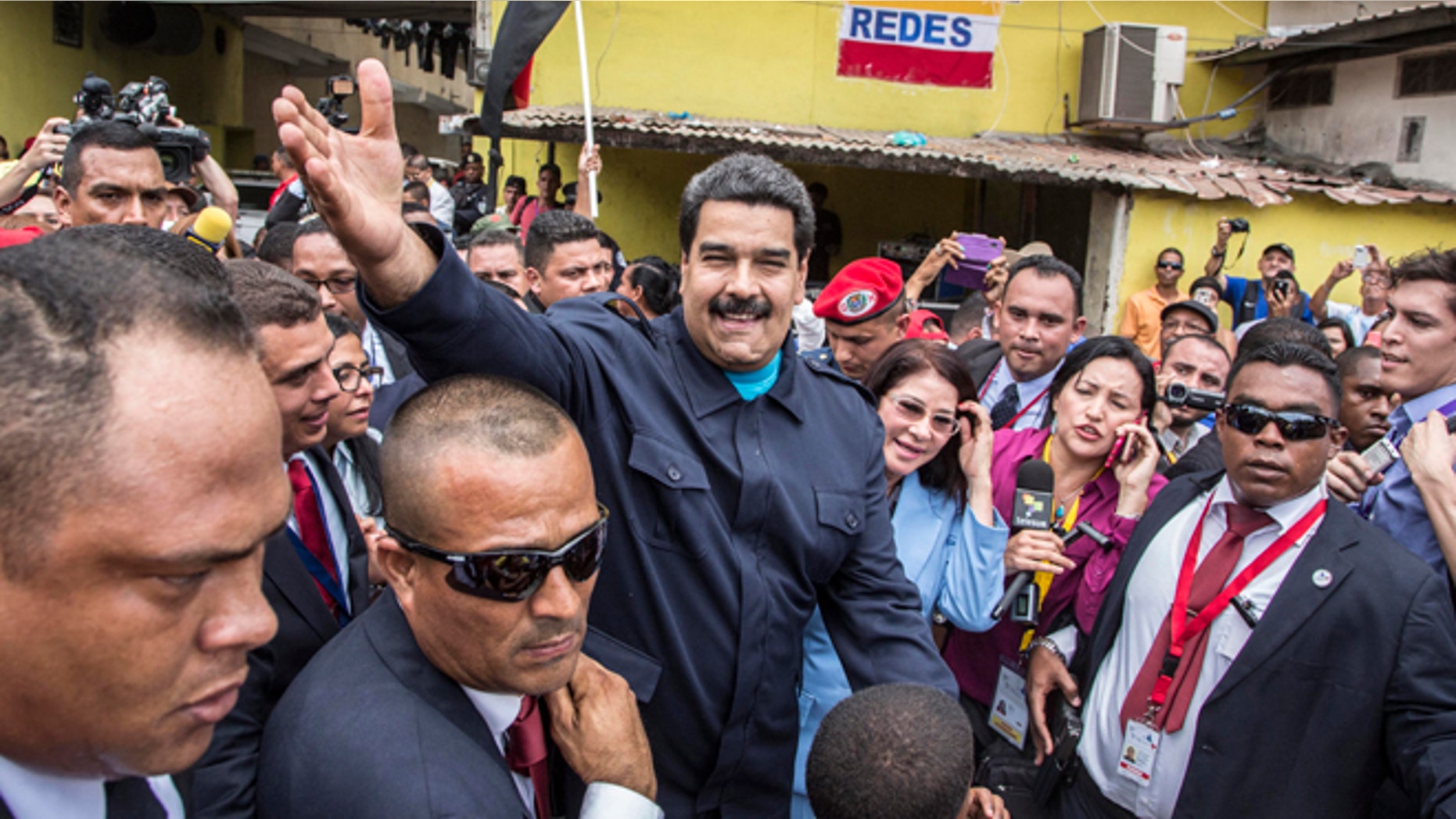 Venezuela's President Nicolas Maduro greets supporters before a ceremony at a monument in honor of the victims of the 1989 U.S. invasion, in the Chorrillo neighborhood which saw the heaviest fighting during the invasion, in Panama City, Friday, April 10, 2015. A crowd of several hundred chanted in Spanish, "Maduro, stick it to the Yankee!" (AP Photo/Ramon Espinosa)