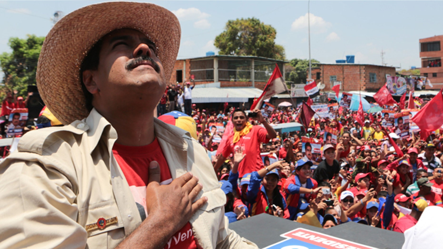 President Nicolas Maduro looks up during a campaign rally in San Fernando de Apure, Venezuela, Sunday, April 7, 2013.