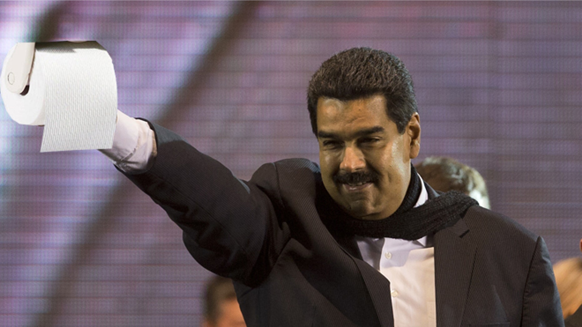 Venezuela's President Nicolas Maduro flashes a victory sign during a rally in Buenos Aires, Argentina, Wednesday, May 8, 2013. Maduro said Venezuela and Argentina are more closely aligned than ever despite the deaths of Venezuelan President Hugo Chavez and of Nestor Kirchner, the husband of President Cristina Fernandez who preceded her in the presidency. (AP Photo/Victor R. Caivano)