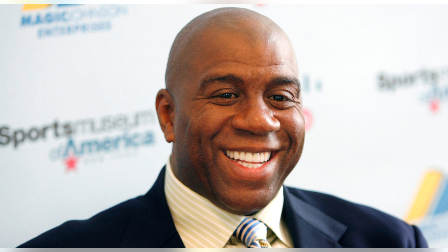 Basketball legend turned entrepreneur Magic Johnson tours the Sports Museum of America in New York, Friday, Nov. 21, 2008. A group that includes former Lakers star Magic Johnson and longtime baseball executive Stan Kasten agreed Tuesday night March 27, 2012 to buy the Los Angeles Dodgers from Frank McCourt for $2 billion. (AP Photo/Seth Wenig)
