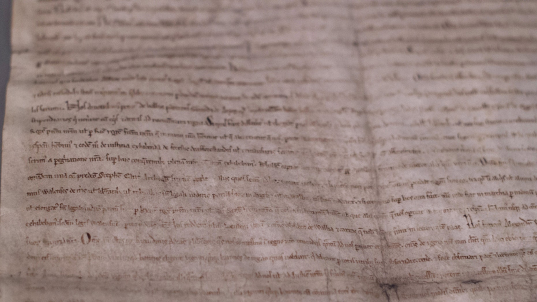 A close-up view of one of four remaining copies of the original Magna Carta, a document written in 1215, is seen at the Museum of Fine Arts in Boston June 30, 2014.