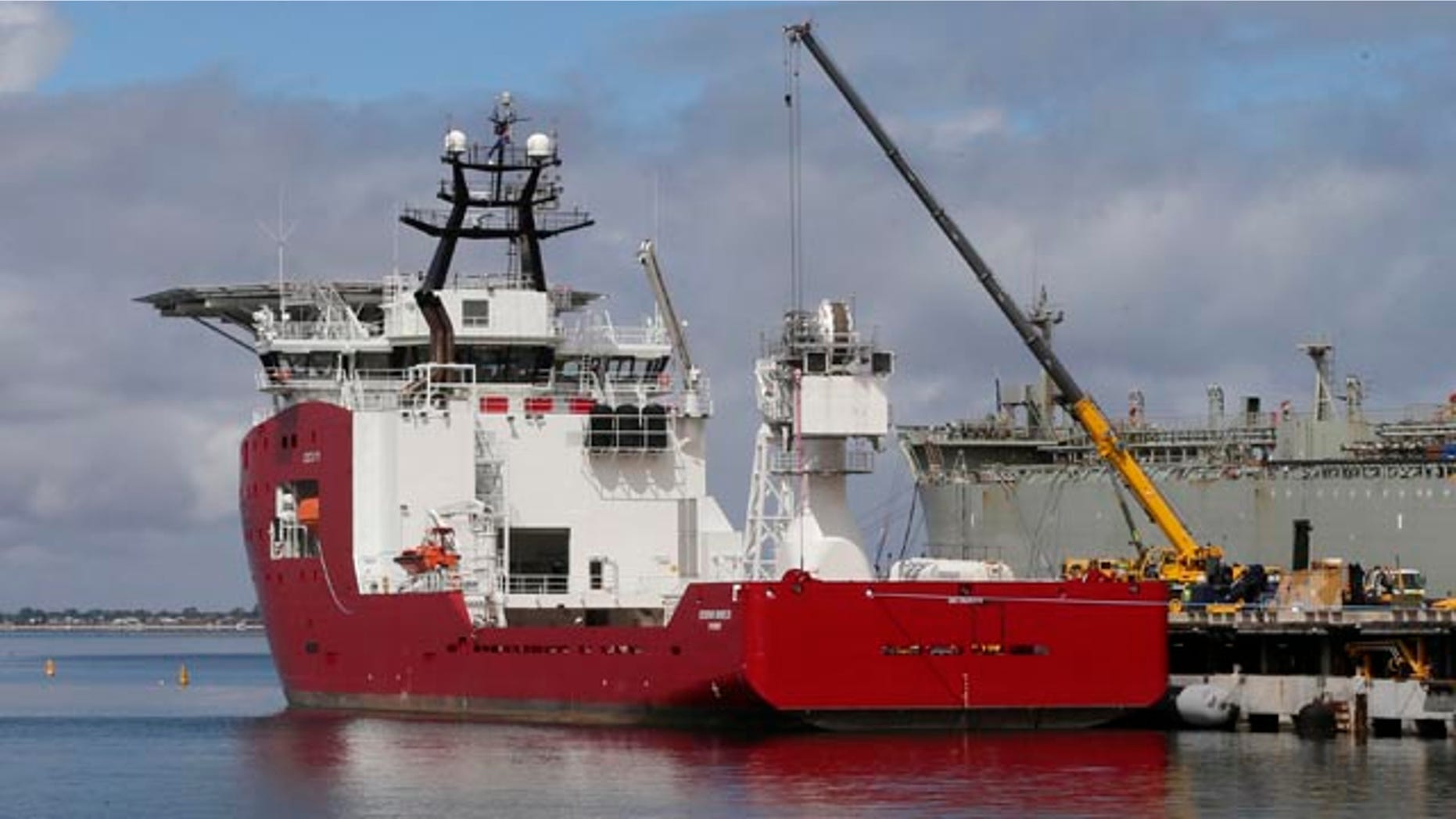 FILE - In this March 30, 2014 file photo, Australian navy ship Ocean Shield lies docked at naval base HMAS Stirling while being fitted with a towed pinger locator to aid in her roll in the search for missing Malaysia Airlines Flight MH370 in Perth, Australia. (AP Photo/Rob Griffith, File)