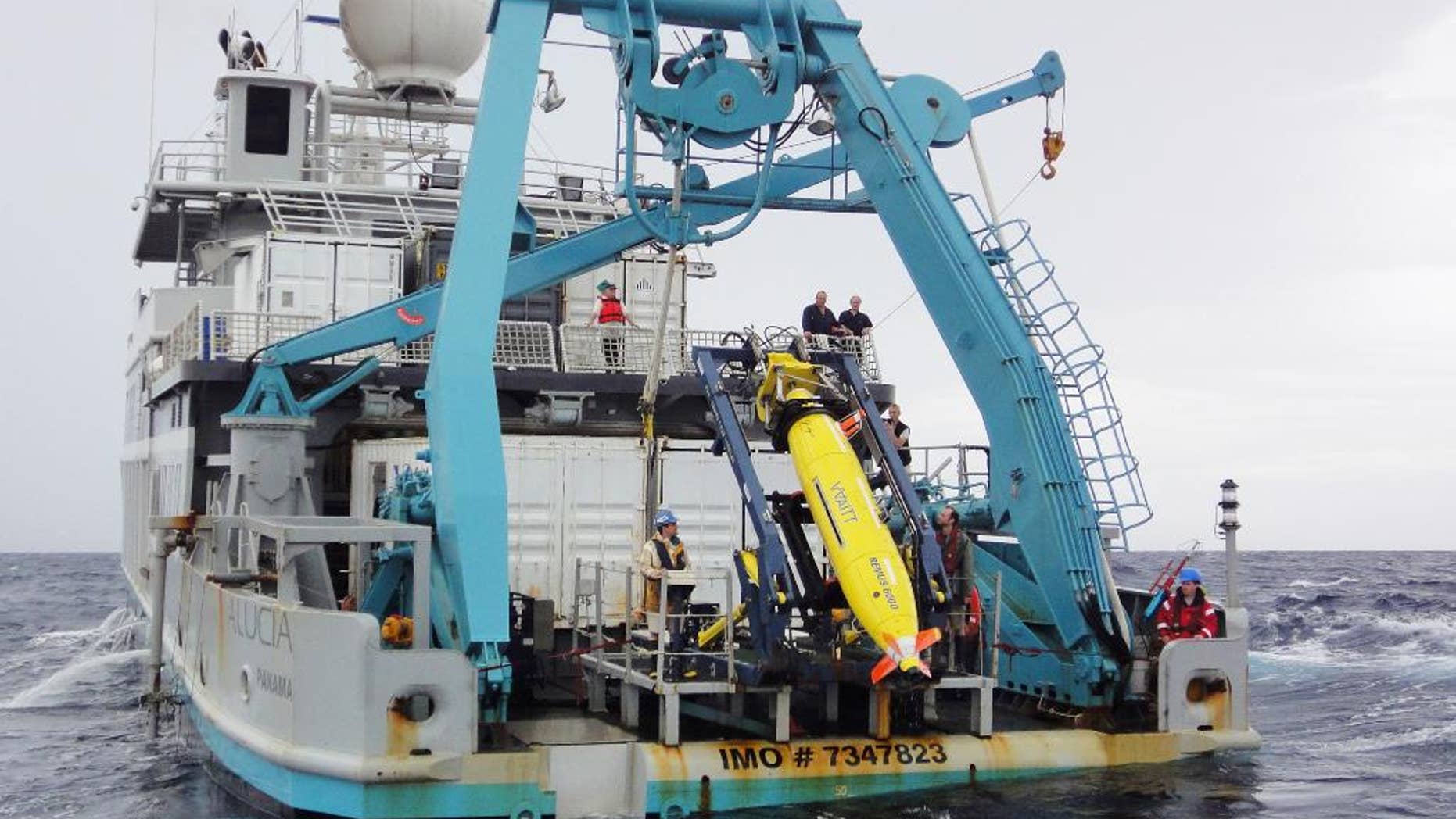 This 2011 photo provided by Sylvain Pascaud shows the ship Alucia and the REMUS 6000 robot sub during the search for Air France Flight 447. Unmanned subs, also called autonomous underwater vehicles or AUVs, played a critical role in locating the wreckage of the lost Air France jet, two years after it crashed in the middle of the south Atlantic. The find allowed searchers to recover the black boxes that revealed the malfunctions behind the tragedy. (AP Photo/Sylvain Pascaud)