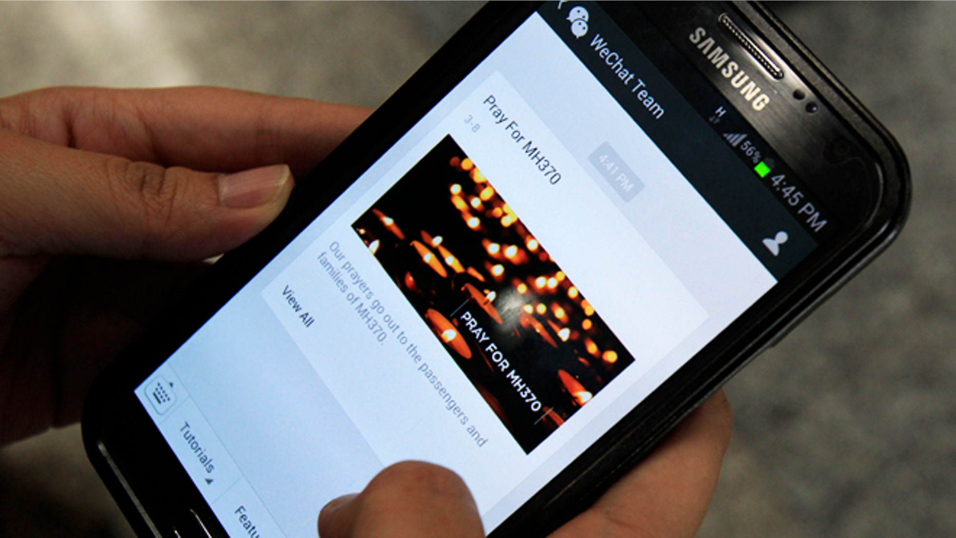 March 8, 2014: A message "Pray for MH370" is shown by mobile messaging app WeChat on a smartphone at Kuala Lumpur International Airport in Sepang, outside Kuala Lumpur, Malaysia.