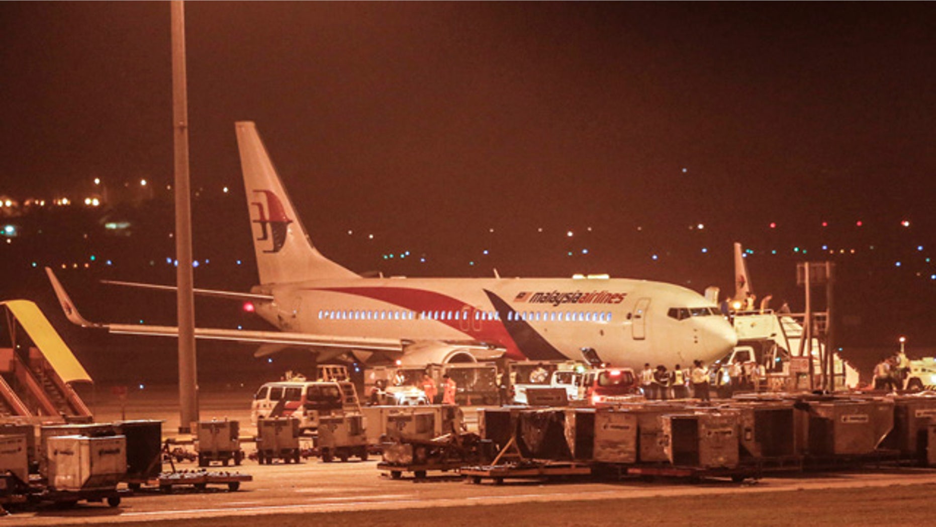 April 21, 2014: Malaysia Airlines flight MH192 bound for Bangalore turned back toward and parked at Kuala Lumpur International Airport in Sepang, Malaysia after its right landing gear malfunctioned upon takeoff. The airline says Flight 192 carrying 166 people landed safely at the Kuala Lumpur International Airport early Monday, four hours after it departed. (AP Photo/Vincent Thian)
