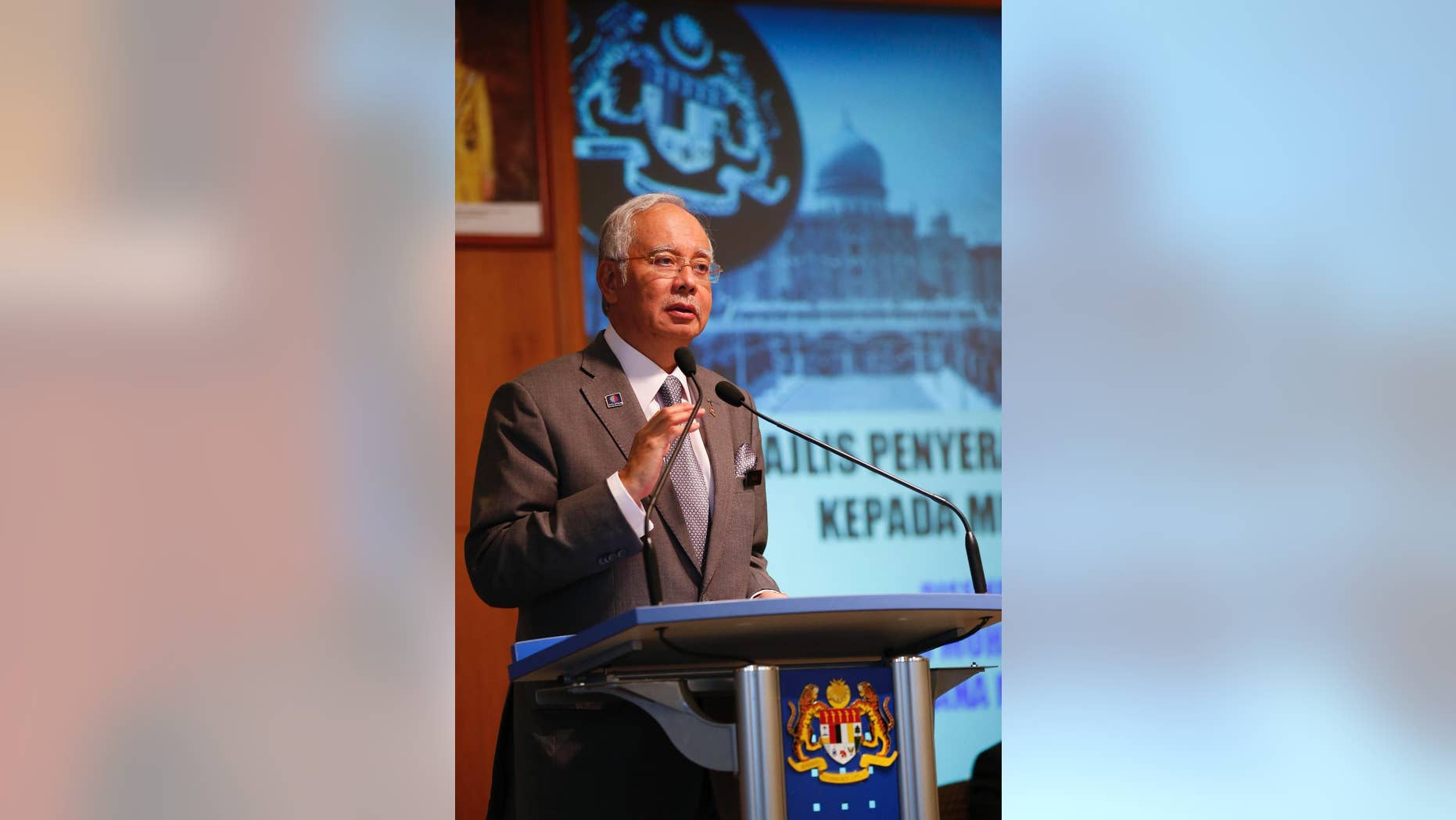 FILE - In this Wednesday, July 8, 2015 file picture t Malaysian Prime Minister Najib Razak speaks during Perdana Fellowship Programme in Putrajaya, Malaysia. Embattled Malaysian Prime Minister Najib Razak is not known to be a risk-taker, but he made his biggest political gamble to stay in power last week as he got rid of critics in his Cabinet, sacked the attorney-general probing him and stalled investigations over leaked confidential documents that allegedly show some $700 million was siphoned out from a troubled state fund into his personal accounts. (AP Photo/Vincent Thian/FILE)