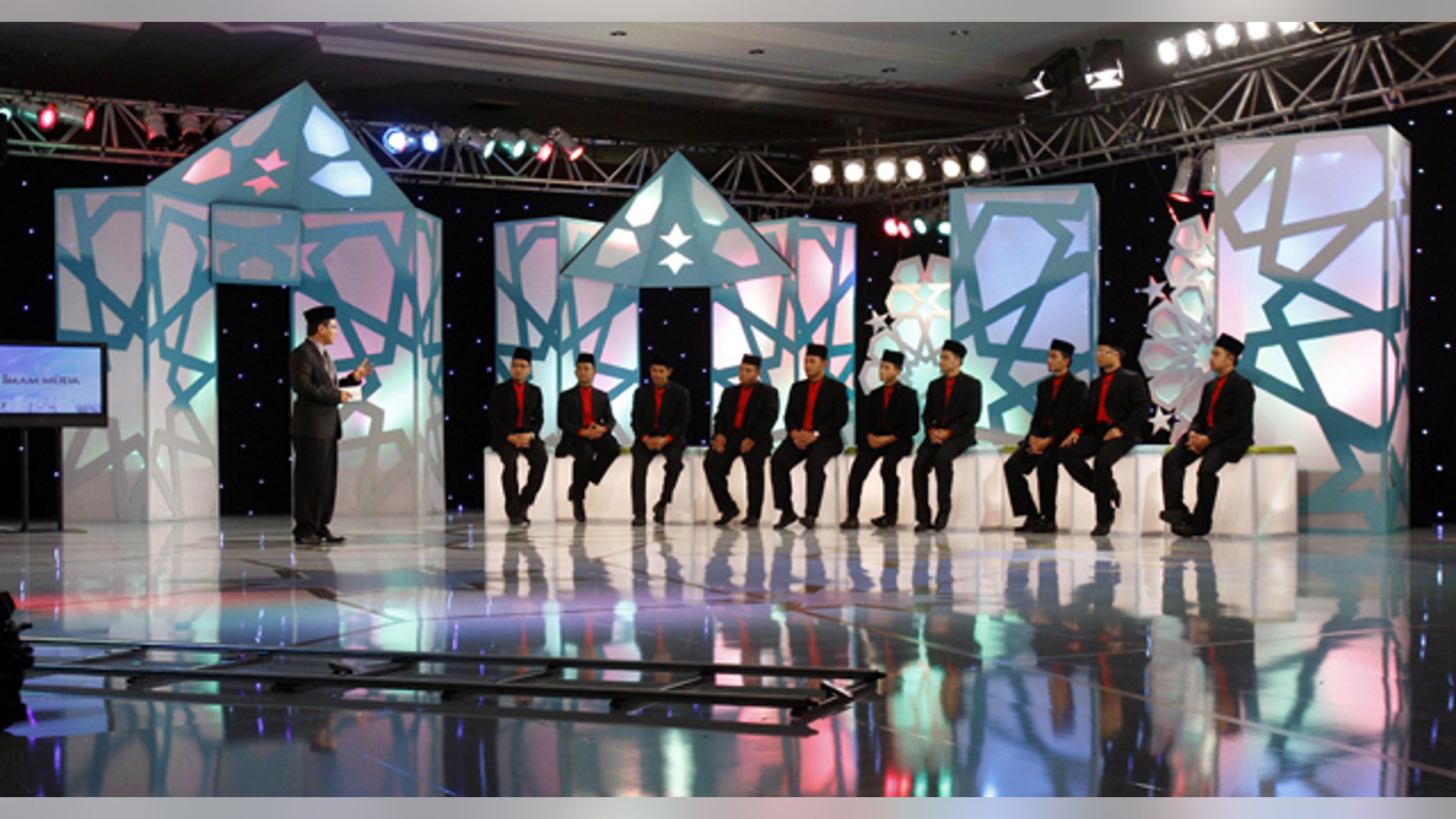 June 14: Contestants sit and listen to host Dzulkarnain Hamzah while filming the reality TV show "Imam Muda" or "Young Leader" at a mosque auditorium in Kuala Lumpur, Malaysia. (AP)