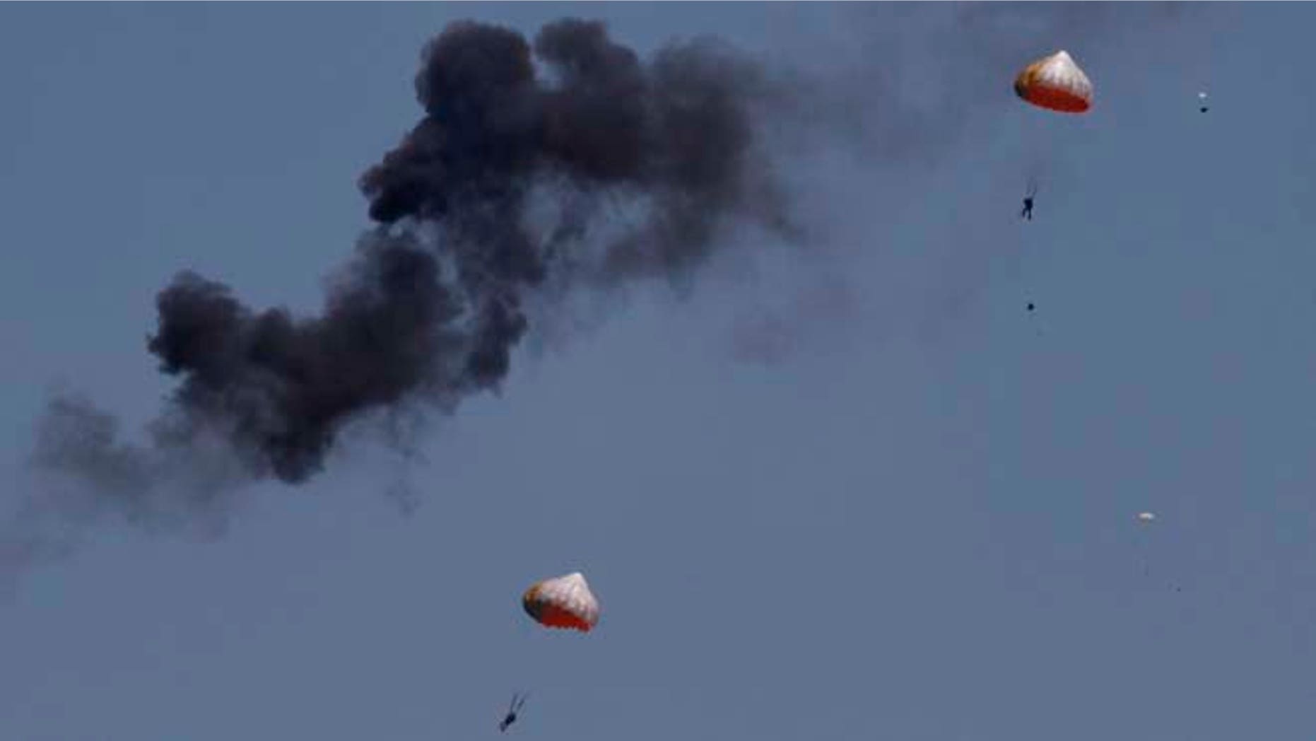 March 15, 2015: Pilots from Indonesias Jupiter aerobatics team are ejected after a mid-air collision during a practice session at the Langkawi International Maritime and Aerospace (LIMA) exhibition in Langkawi, Malaysia. (AP)