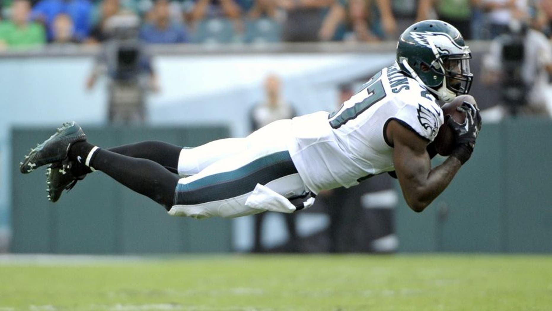 Sep 21, 2014; Philadelphia, PA, USA; Philadelphia Eagles free safety Malcolm Jenkins (27) intercepts a pass in the fourth quarter against the Washington Redskins at Lincoln Financial Field. The Eagles defeated the Redskins, 37-34. Mandatory Credit: Eric Hartline-USA TODAY Sports