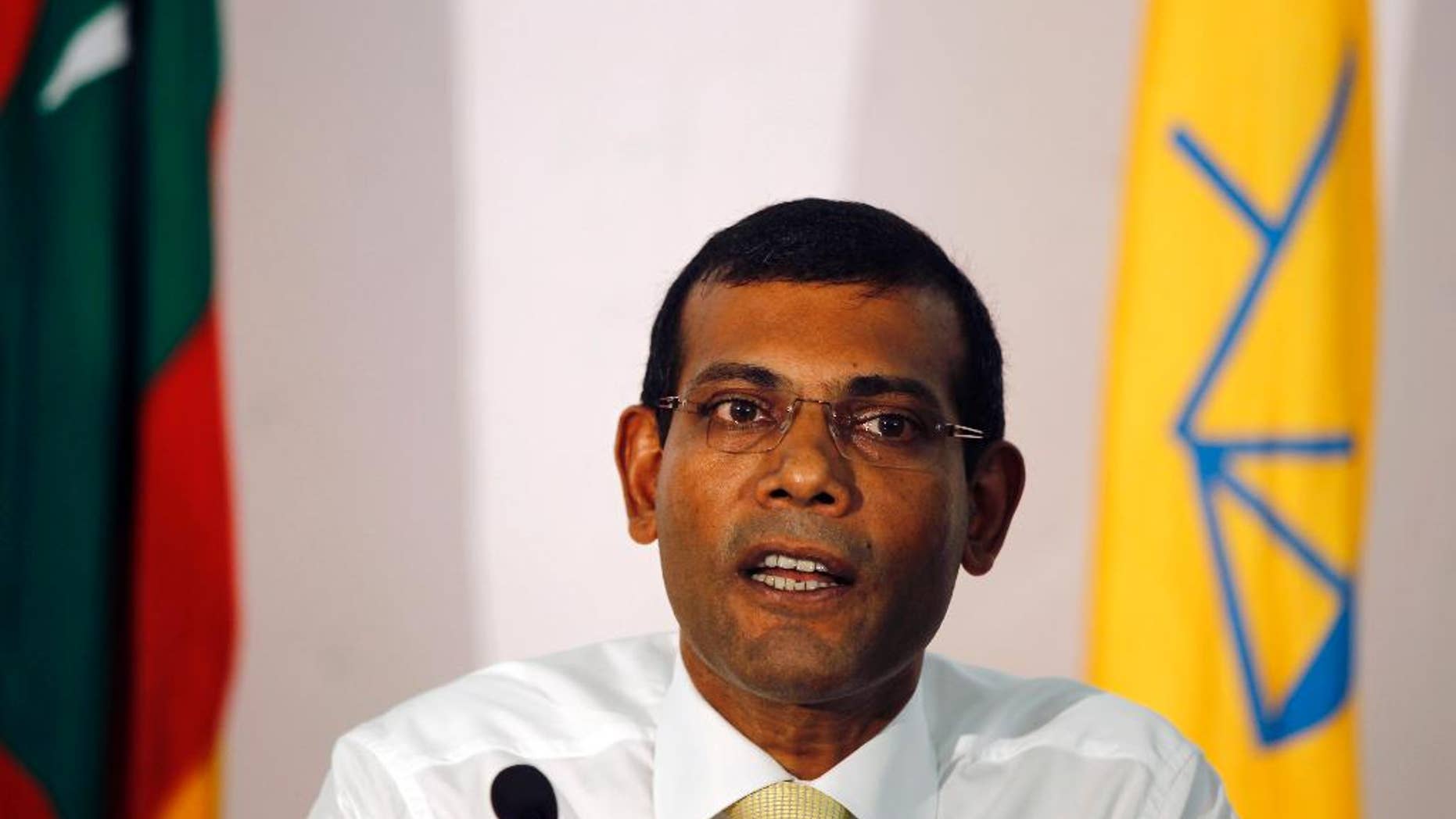 FILE- In this Nov. 10, 2013 file photo, former Maldives President and the then presidential candidate, Mohamed Nasheed, speaks to the media in Male, Maldives. Maldives authorities arrested former President and current opposition leader Nasheed Sunday, Feb. 22, 2015, ordering him to stand trial for his 2012 decision to arrest a senior judge.(AP Photo/Sinan Hussain, File)