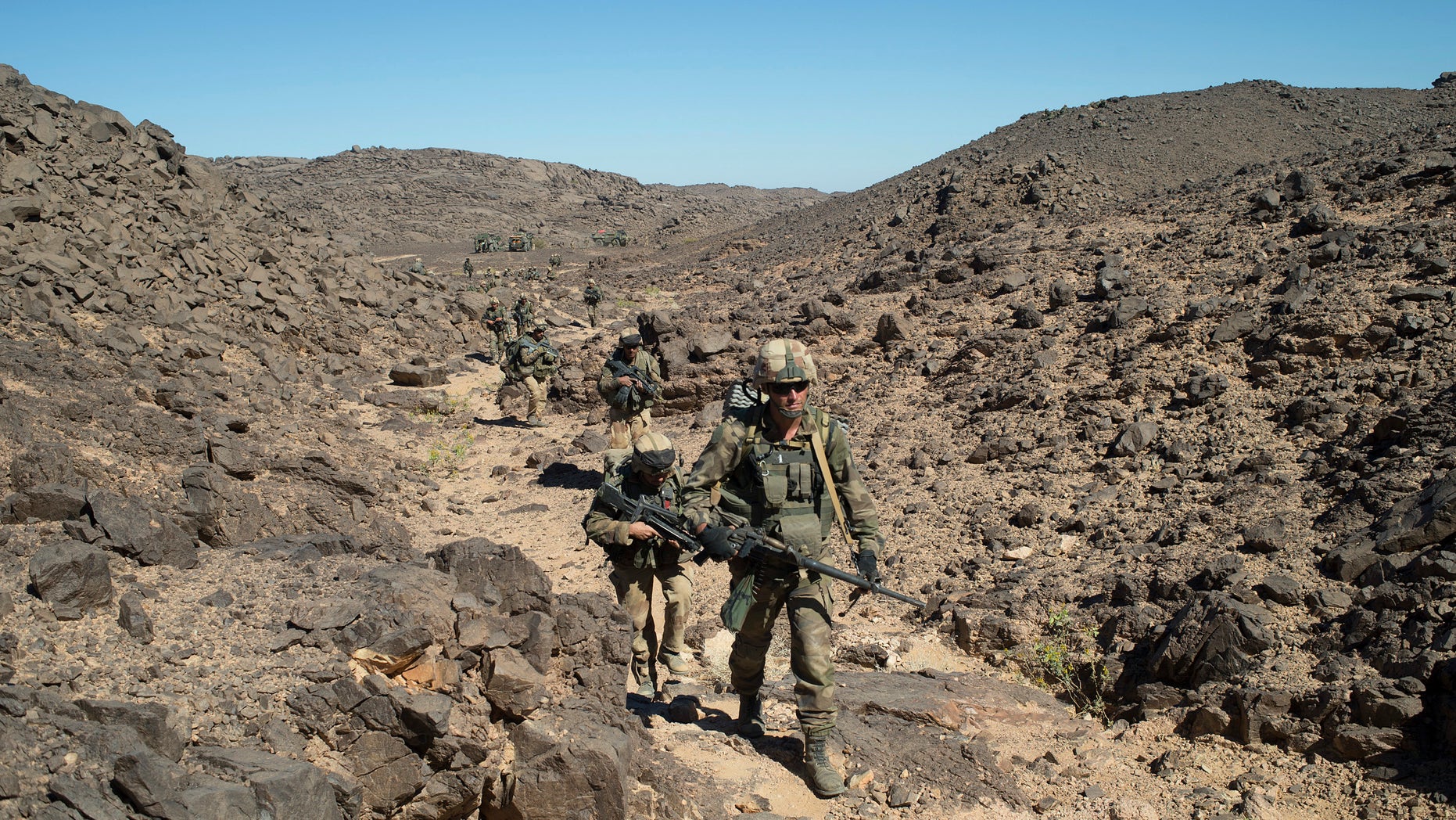 In this photo taken March 8, 2013 by the French Army Communications Audiovisual office (ECPAD) shows French soldiers patrolling in the Mettatai region in northern Mali. France's Presidential office on Saturday March 23 2013 said that DNA testing has shown that Al-Qaeda-linked North African warlord Abou Zeid was killed in combat with French troops in Mali in February.