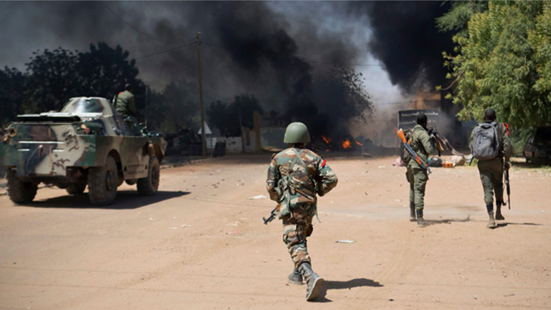 Feb. 21, 2013: Malian soldiers, working with French forces, battling radical Islamic rebels in Gao, Mali.
