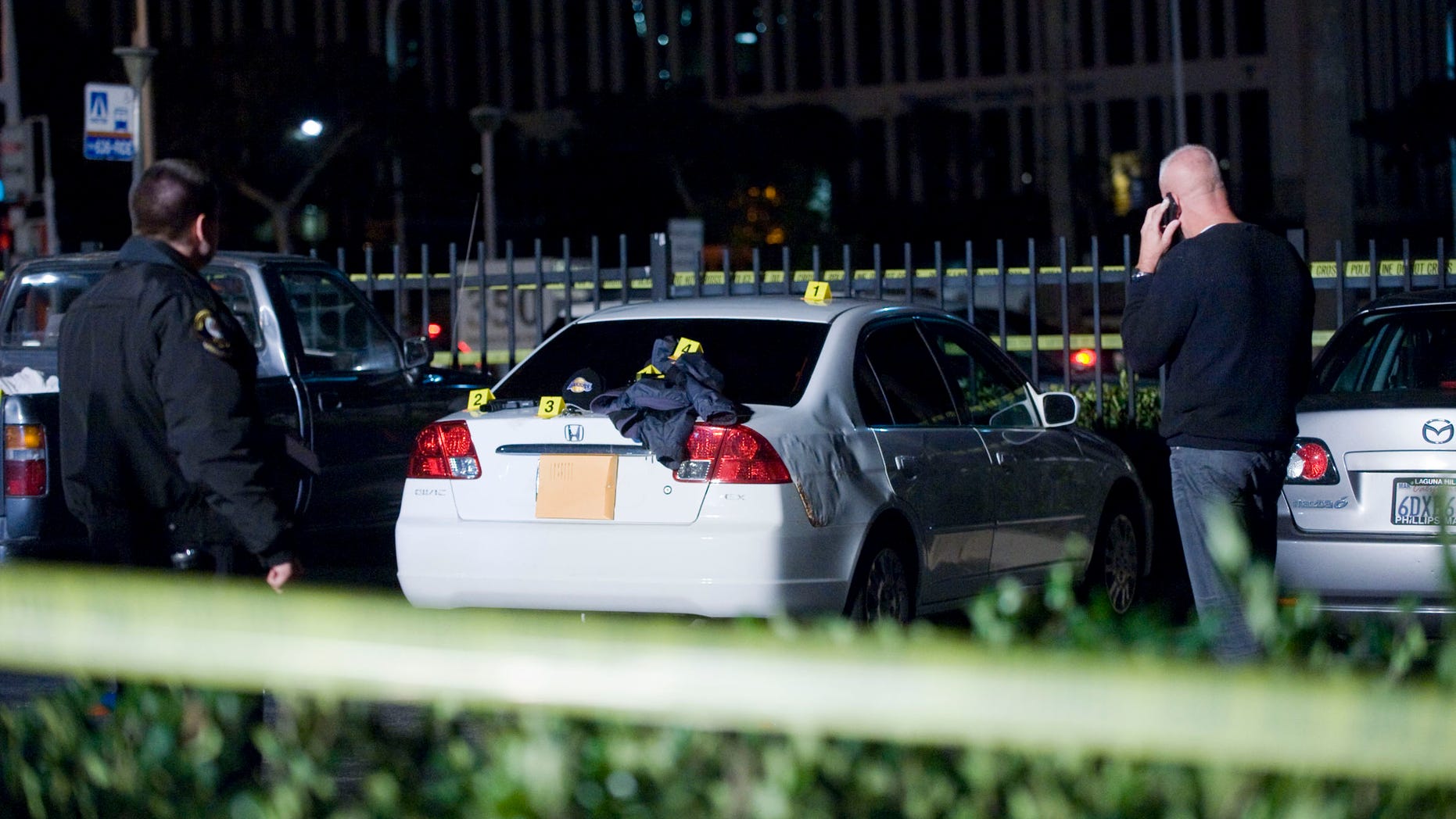 Dec. 15, 2012: Orange County Sheriff deputies patrol at Fashion Island mall in Newport Beach after witnesses reported multiple shots being fired in one of the parking lots.