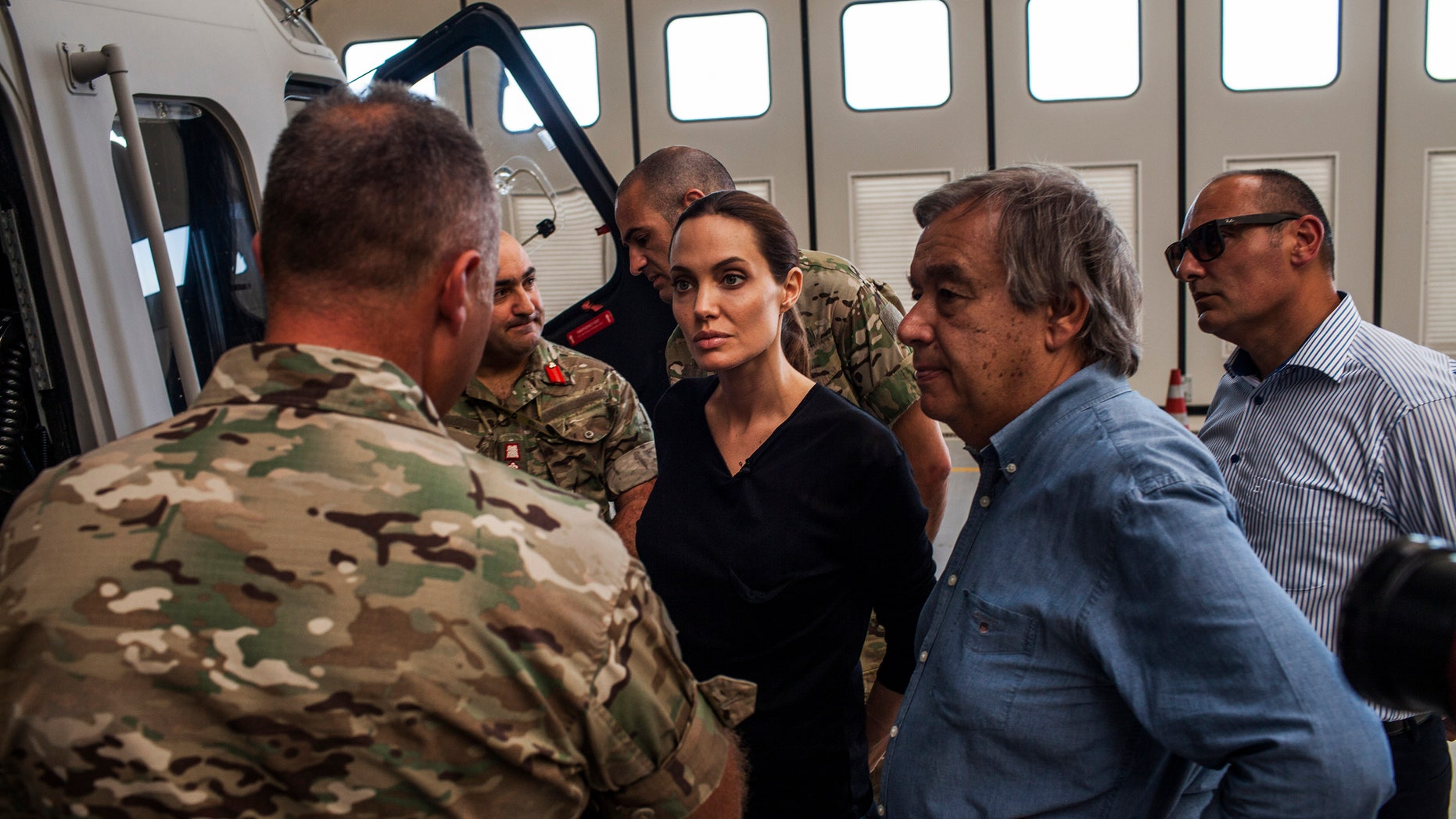 Sept. 15, 2014 - Actress Angelina Jolie-- Special Envoy for UN High Commission for Refugees-- listens to officers in the Maltese military discuss rescue at sea operations for refugees at a military base in Valetta, Malta. Since the start of 2014, more than 2,500 asylum seekers have perished trying to cross the Mediterranean.