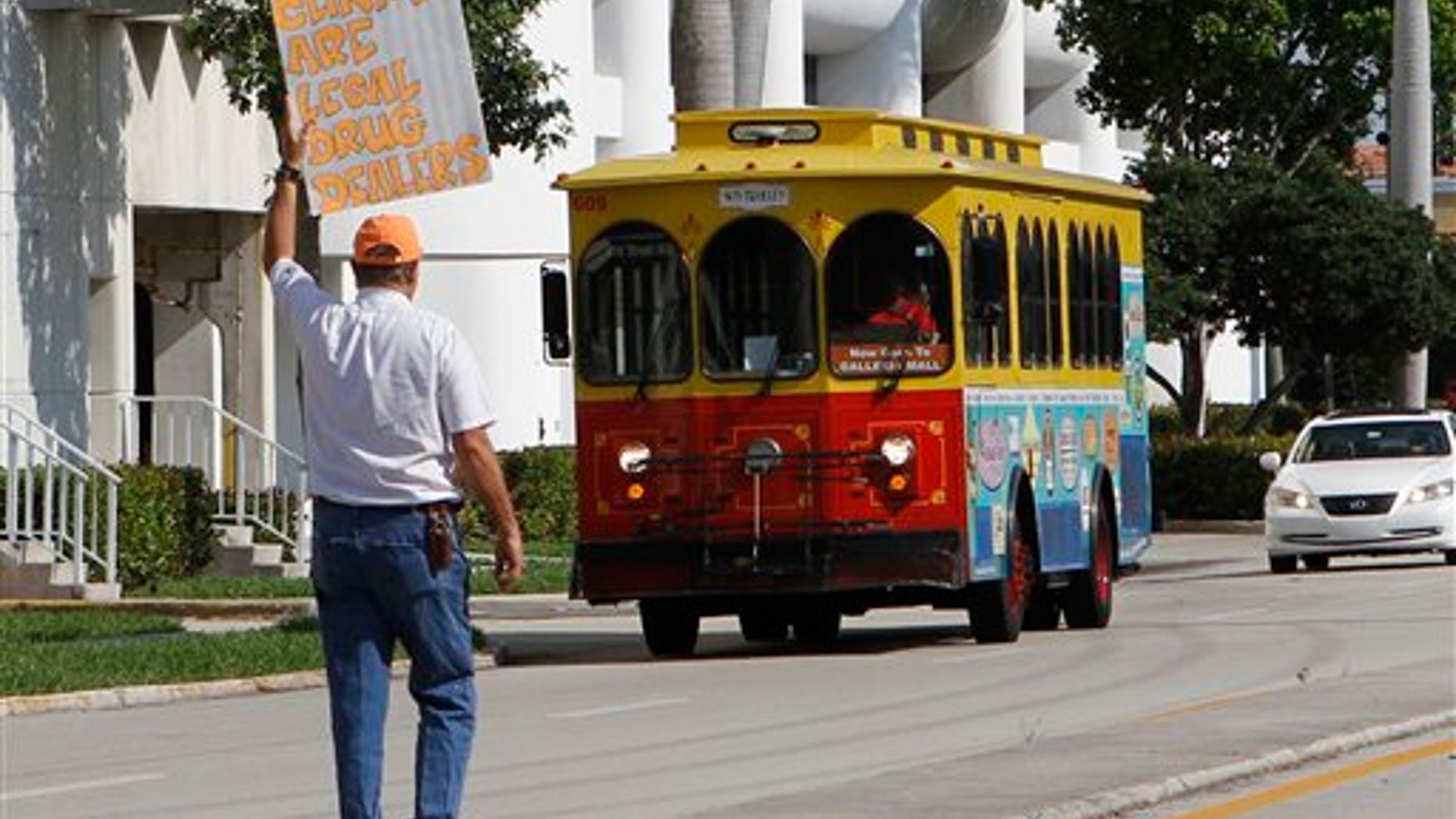 April 15: A protester carries a sign protesting against a pain clinic in Fort Lauderdale, Florida.