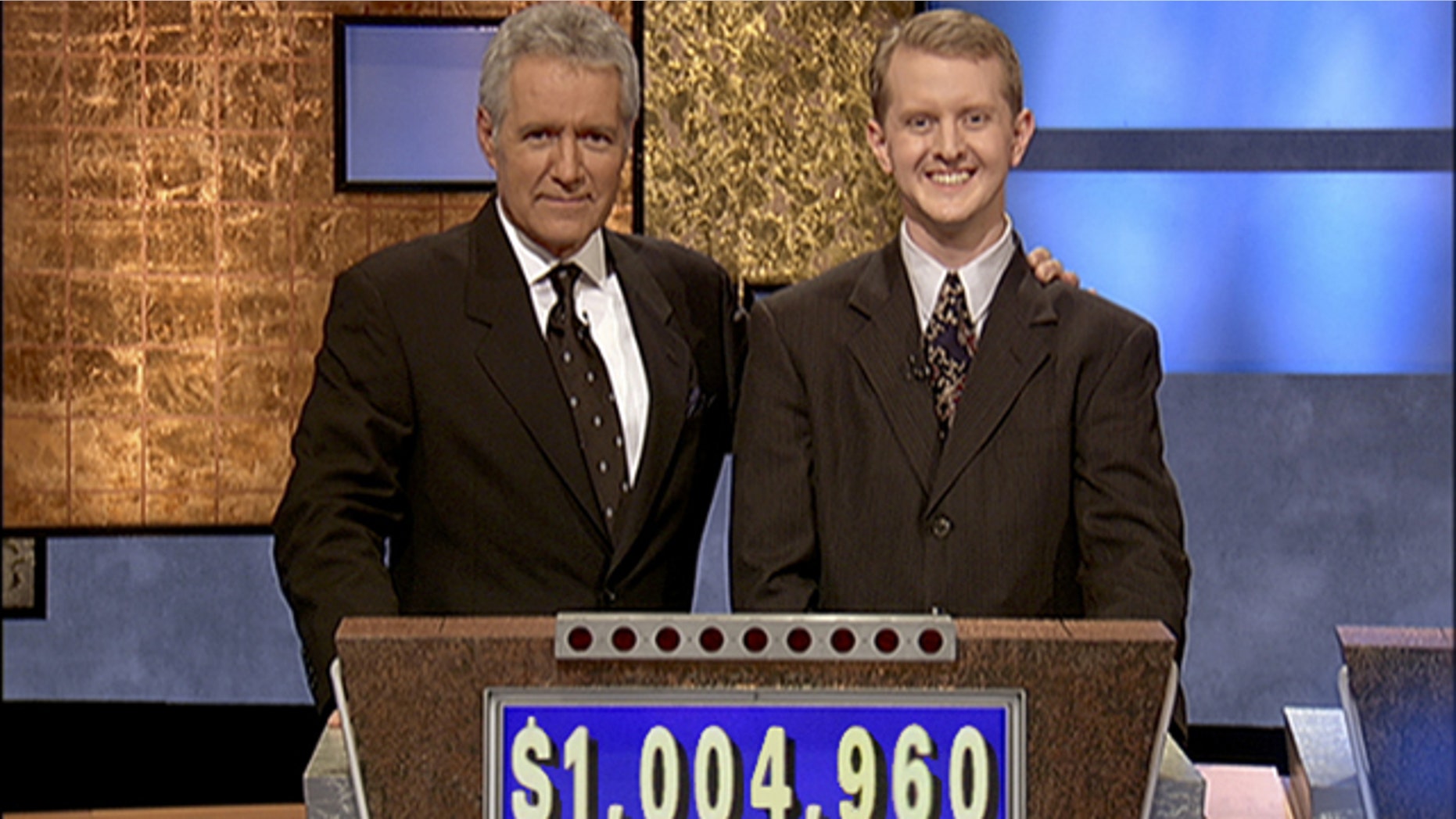 Software developer Ken Jennings from Salt Lake City, Utah poses for a photo with Jeopardy host Alex Trebek on the set of the show in Culver City, Calif. On Thursday Jan. 13, 2011 IBM computer Watson will play a practice round against Jennings, who won a record 74 consecutive "Jeopardy!" games in 2004-05.