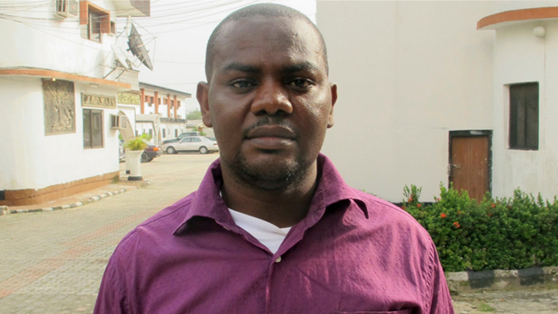June 12, 2013: Harrison Okene, 29, poses for a photograph after an interview with Reuters outside an hotel in Nigeria.